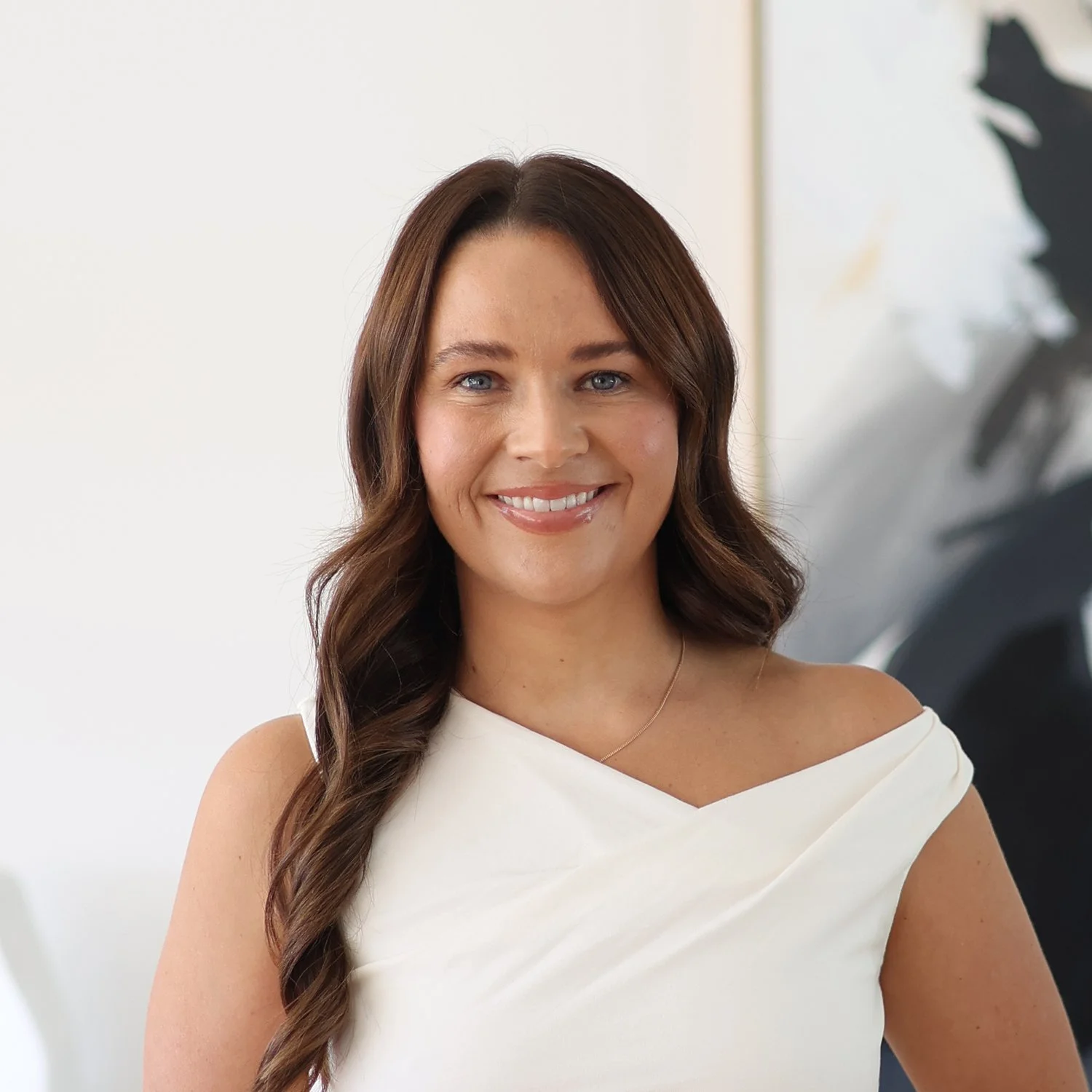 Genevieve Lyons
Senior Mortgage Broker at Sphere Home Loans  with long brown hair, blue eyes, and a white off-shoulder top
