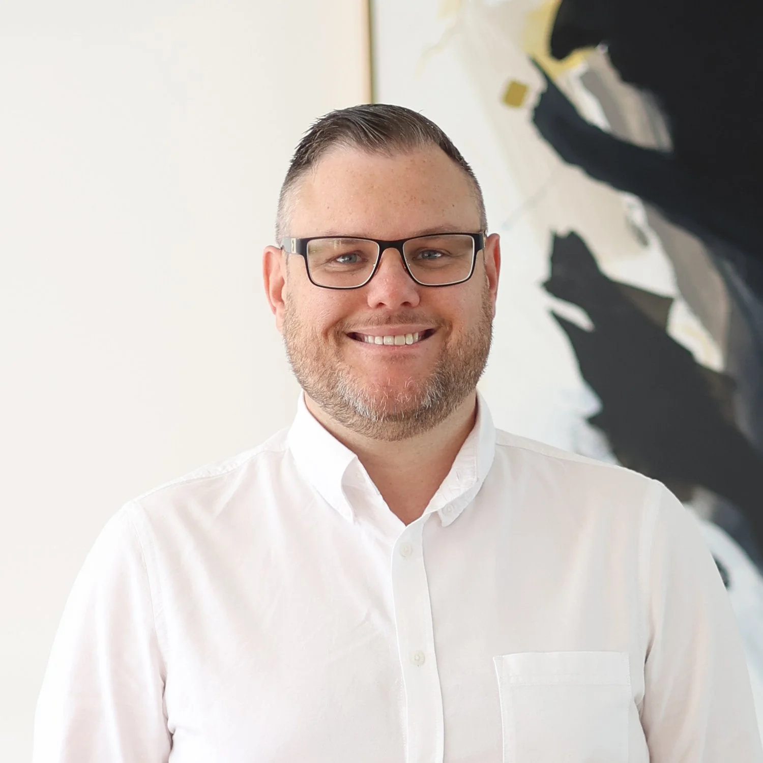Nathan Dobie
Senior Mortgage Broker at Sphere Home Loans with glasses and a beard, wearing a white shirt.