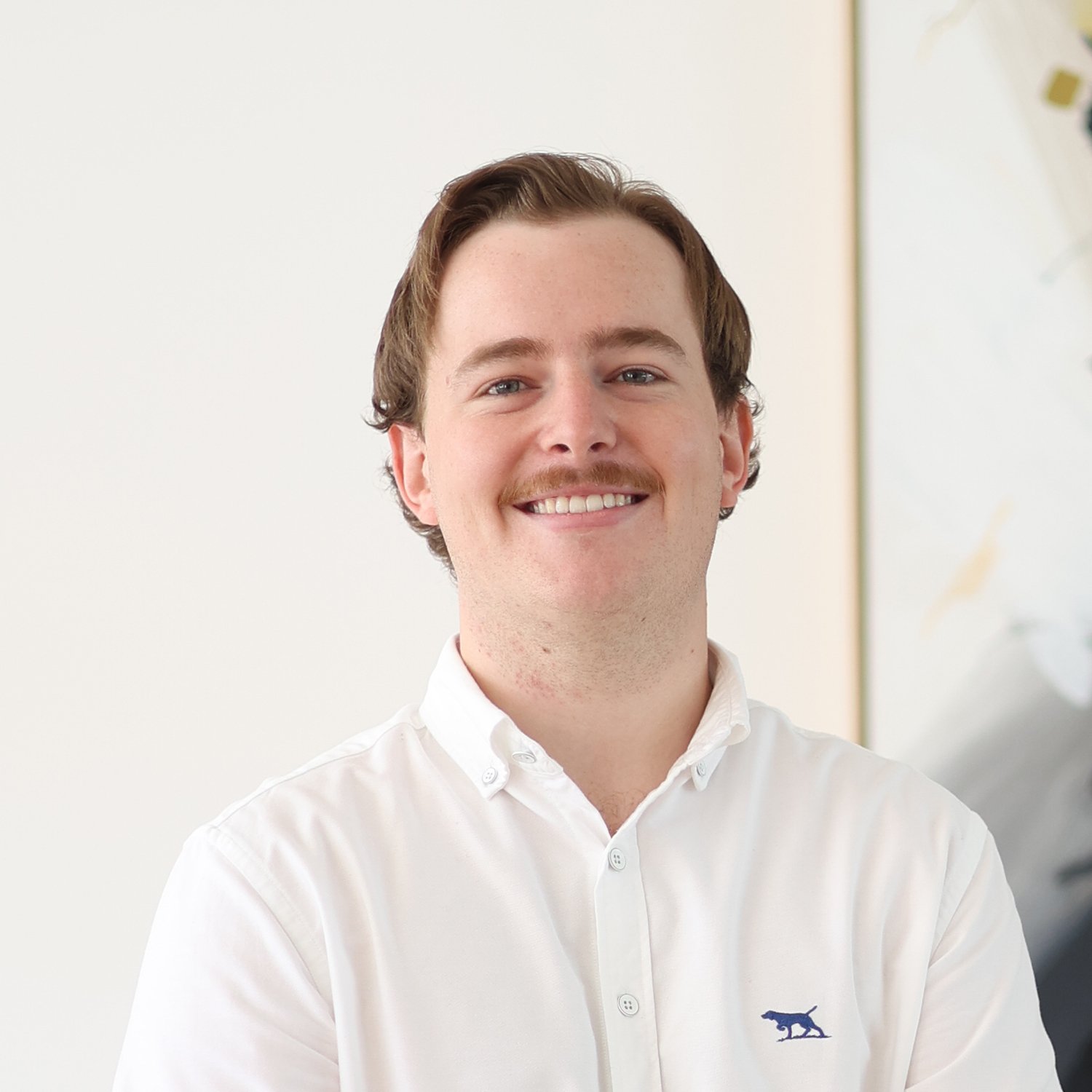 Kyle Gordon, Mortgage Broker at Sphere Home Loans wearing a white button-down shirt.