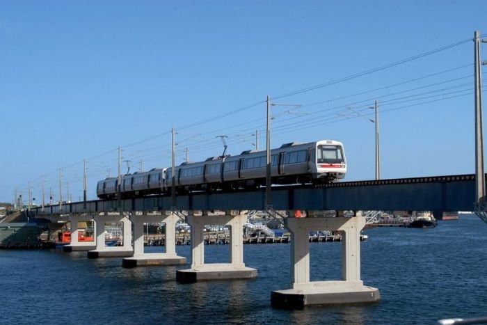 A train makes its way across a rail bridge 2014
