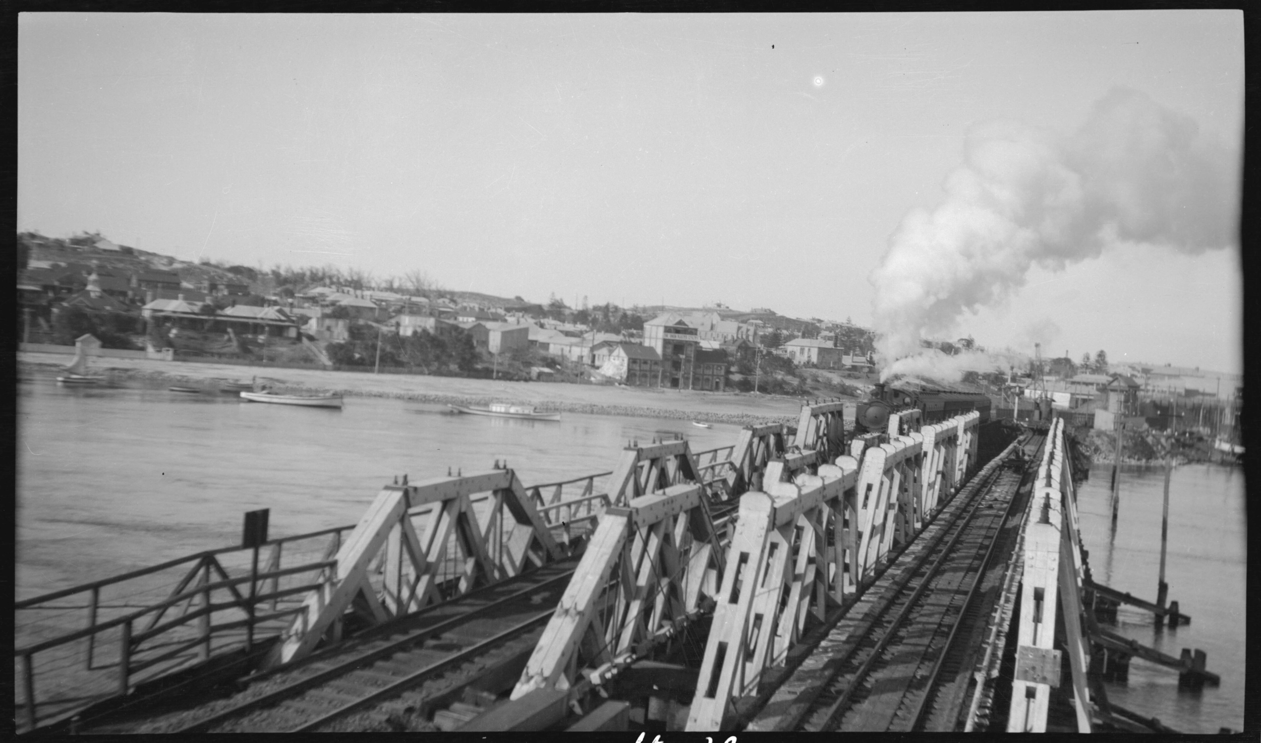 111957PD: Steaming across railway bridge, 1924
