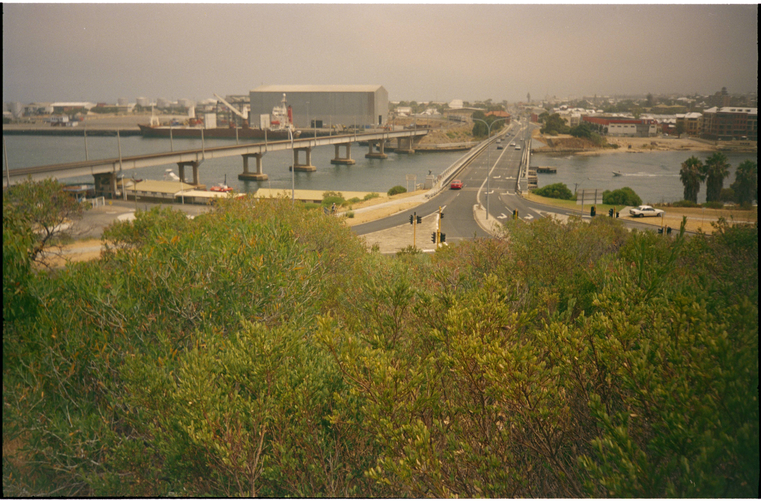 325049PD: A train crosses the Fremantle Railway Bridge, 28 August 1984
