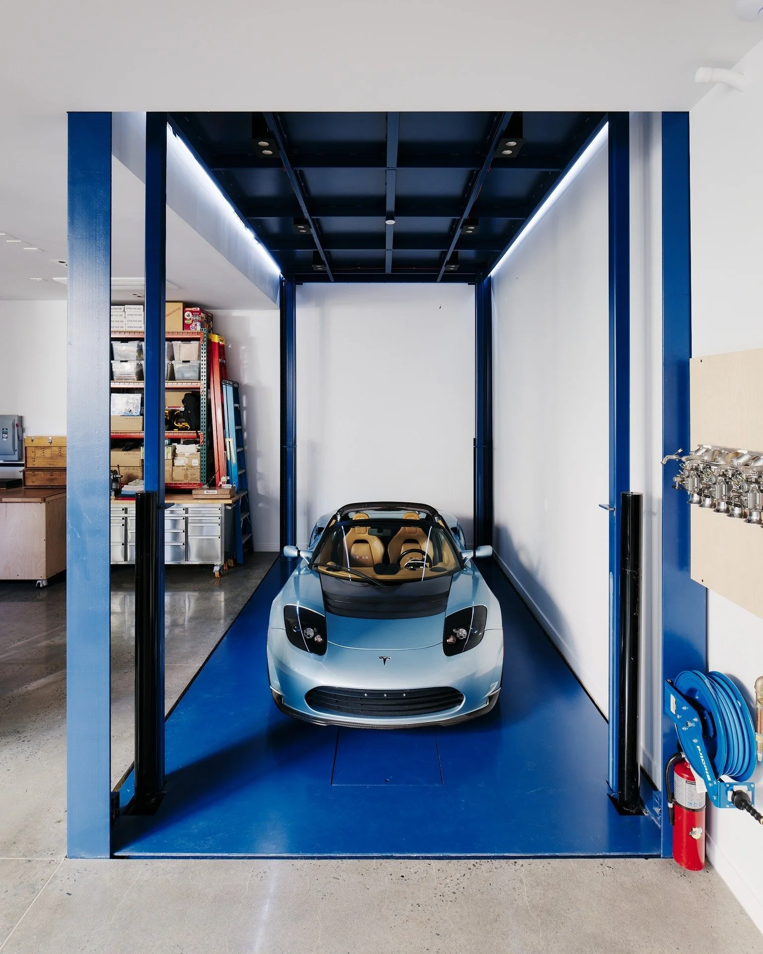 Just your everyday, subterranean car lift! Designed for a collector and engineered for repeat joy, our #HouseOfLightAndShadow has a surprise around every corner.

Builder @mnbuild 
📸 @joefletcherphoto 
.
.
.
#OFA #ogawafisher #ogawafisherarchitects 