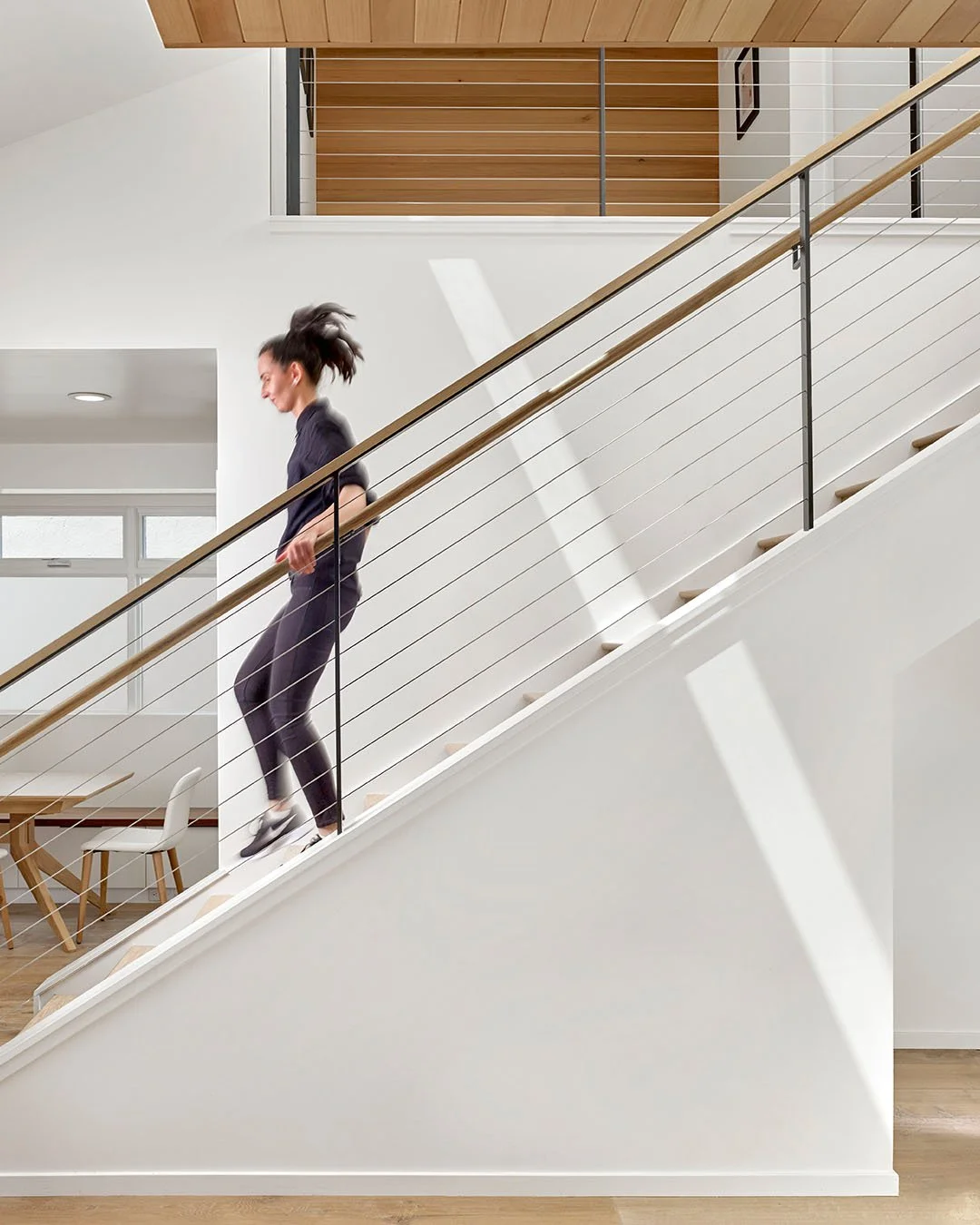 In San Carlos, we rethought a compact ranch home by opening it sideways and up. A reorientation of the stair unlocks an open loft that allows daylight to flow through the plan. Vaulted ceilings and skylights brighten the core, while larger openings s