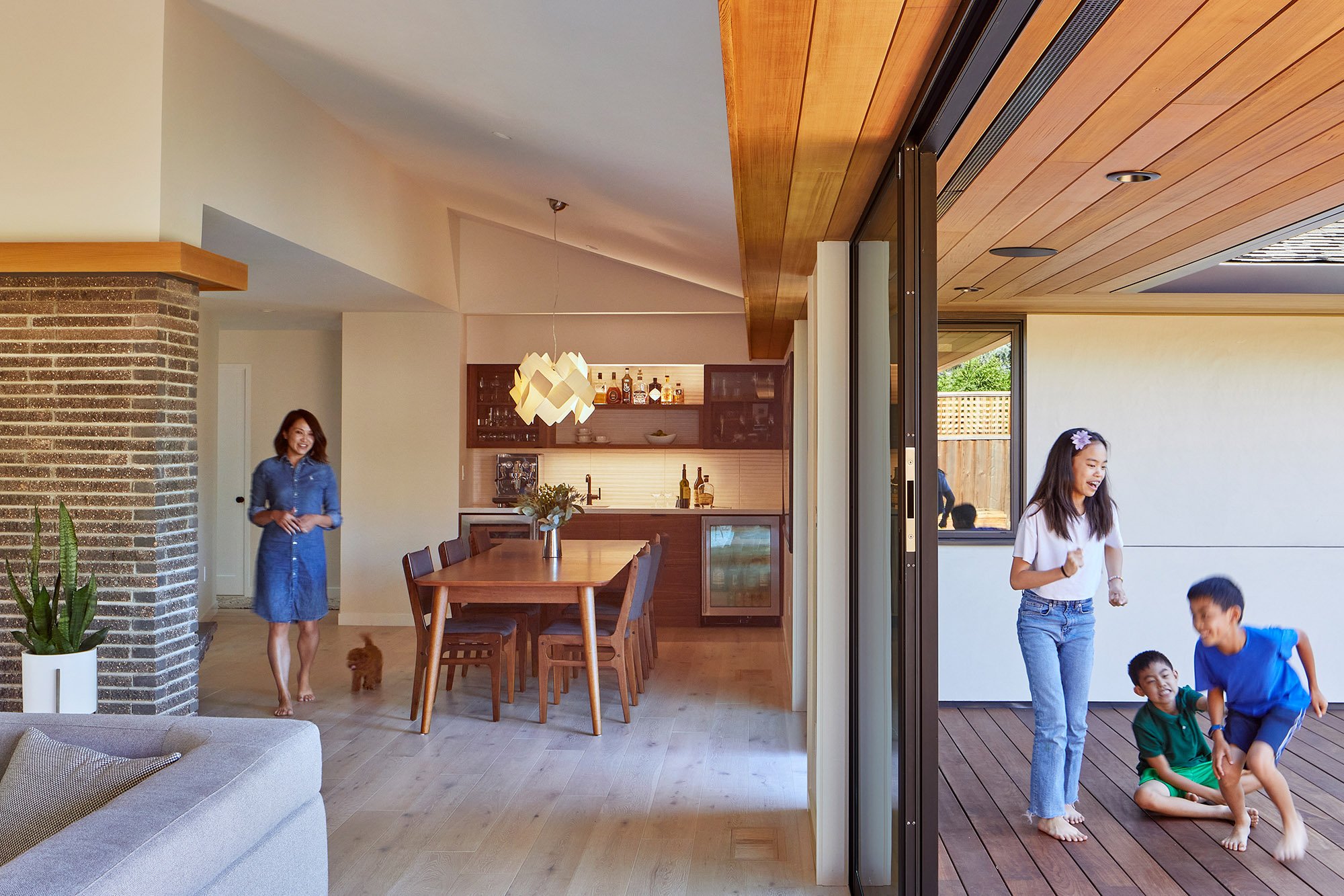 At the #EngawaHouse, the dining core was opened up and brightened: dark paneling and heavy curtains gave way to a light palette, new lighting, and a built-in bar. Large sliding glass doors now open directly to the deck and garden courtyard, creating 