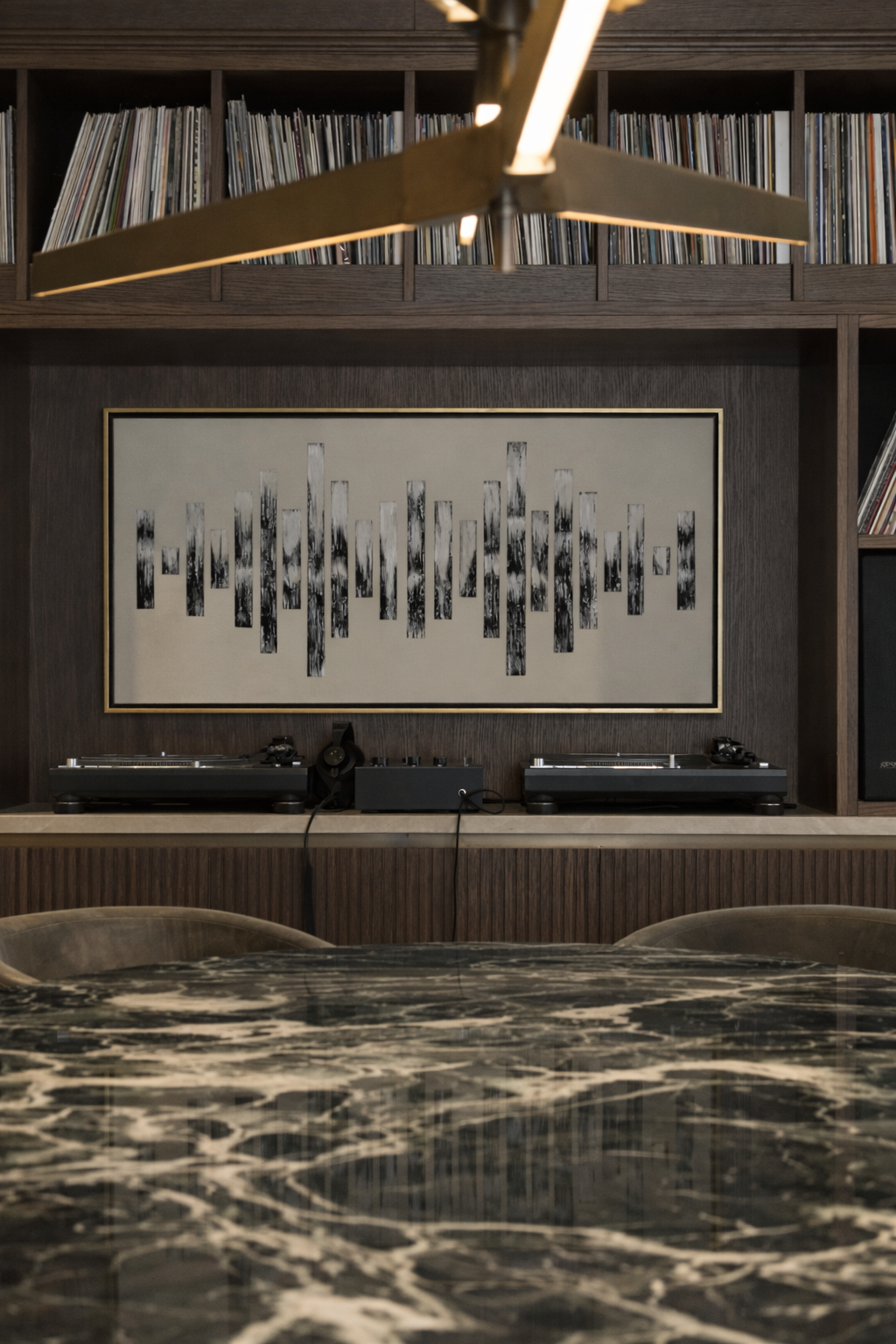 luxury entertainment lounge design with bespoke joinery, pendant light and Dj decks