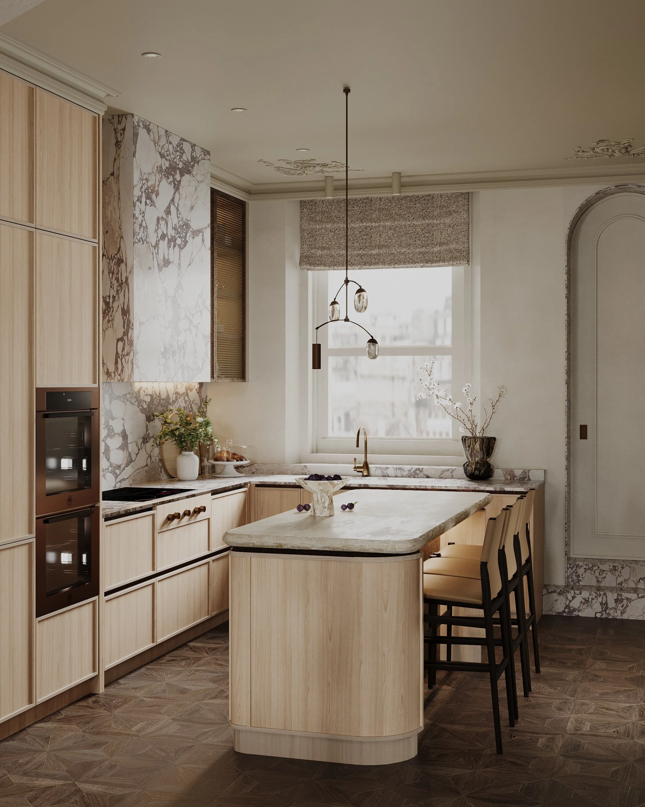 Modern kitchen with light wood cabinets, a marble island, and a large window with a Roman shade, decorated with flowers and a pendant light fixture.