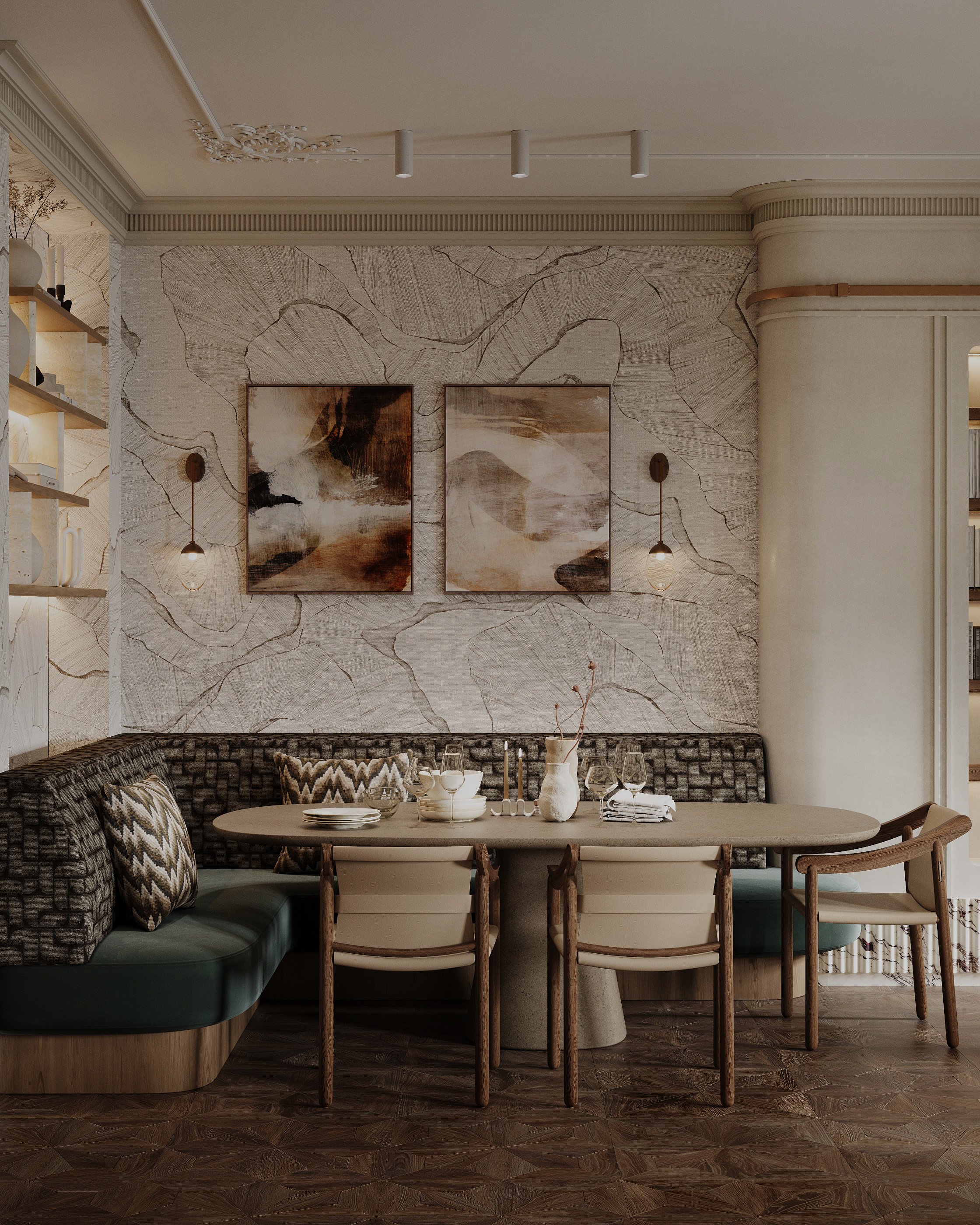 A dining area with a curved built-in bench with patterned pillows, a round table set with white dishes, glasses, and a vase with branches. The wall behind features abstract paintings and wall-mounted lights, with a decorative textured wallpaper and f
