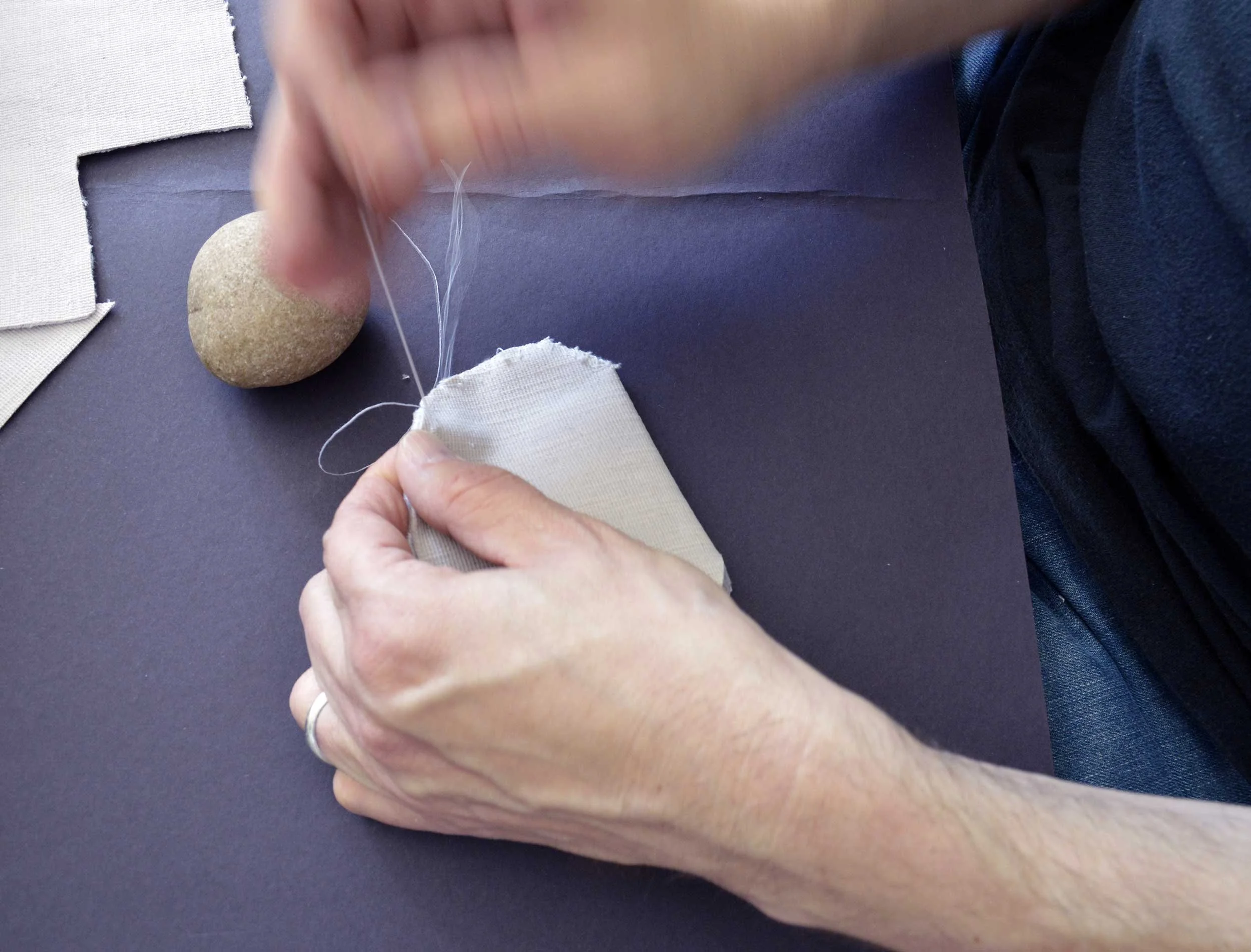  Velvet Stones (Process) ; Creek-collected stones, vintage lavender velvet, sewing materials; 100 count; 2019