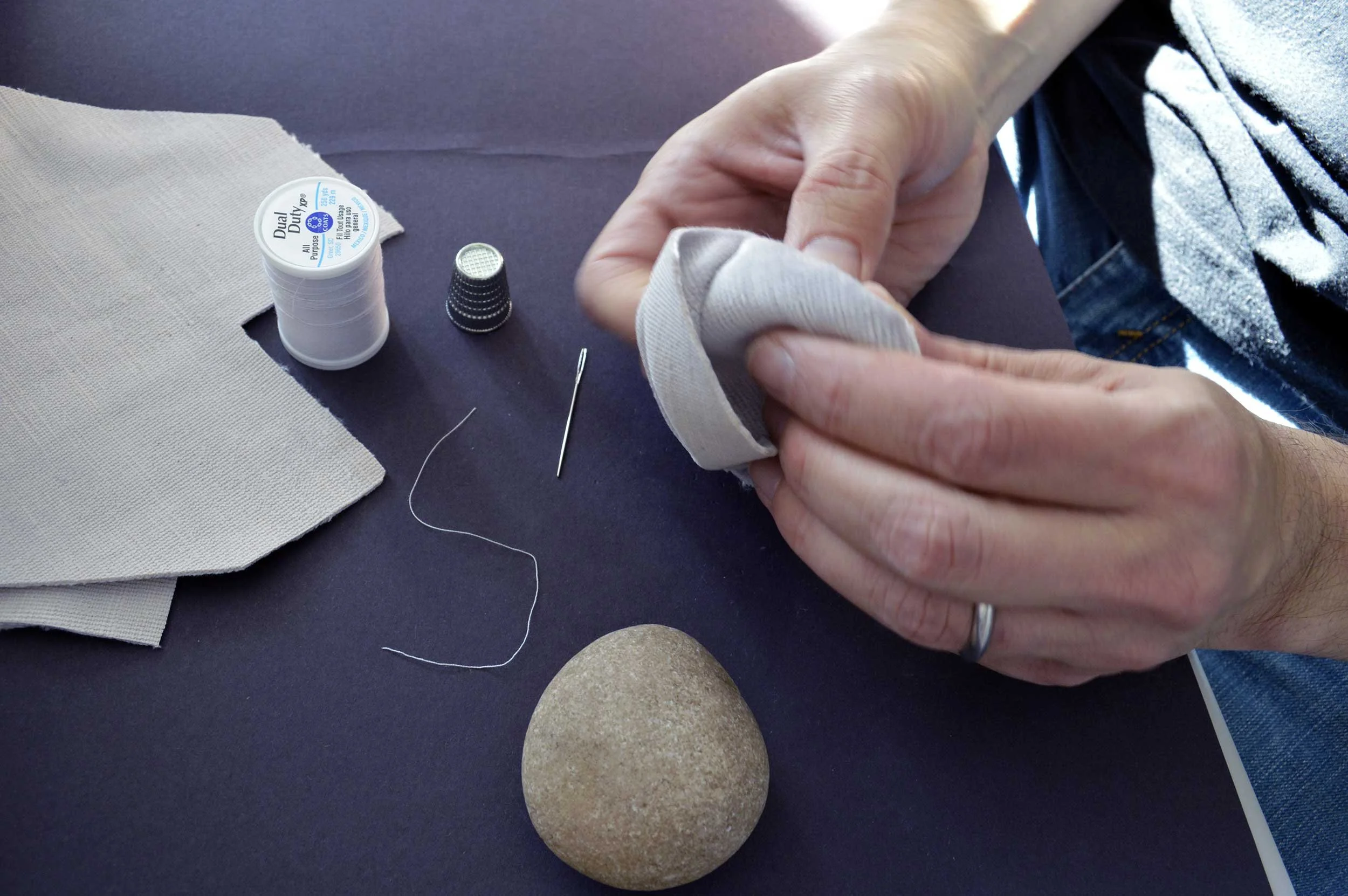  Velvet Stones (Process) ; Creek-collected stones, vintage lavender velvet, sewing materials; 100 count; 2019