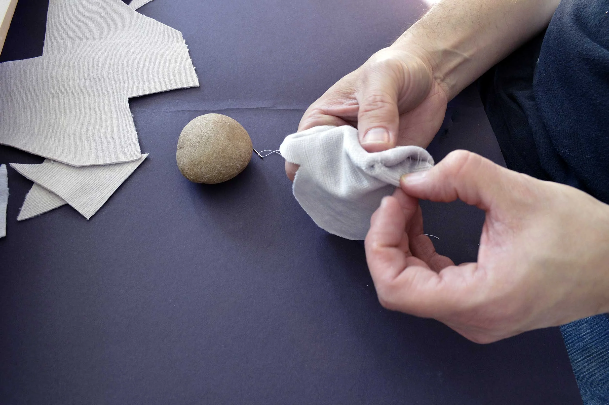  Velvet Stones (Process) ; Creek-collected stones, vintage lavender velvet, sewing materials; 100 count; 2019