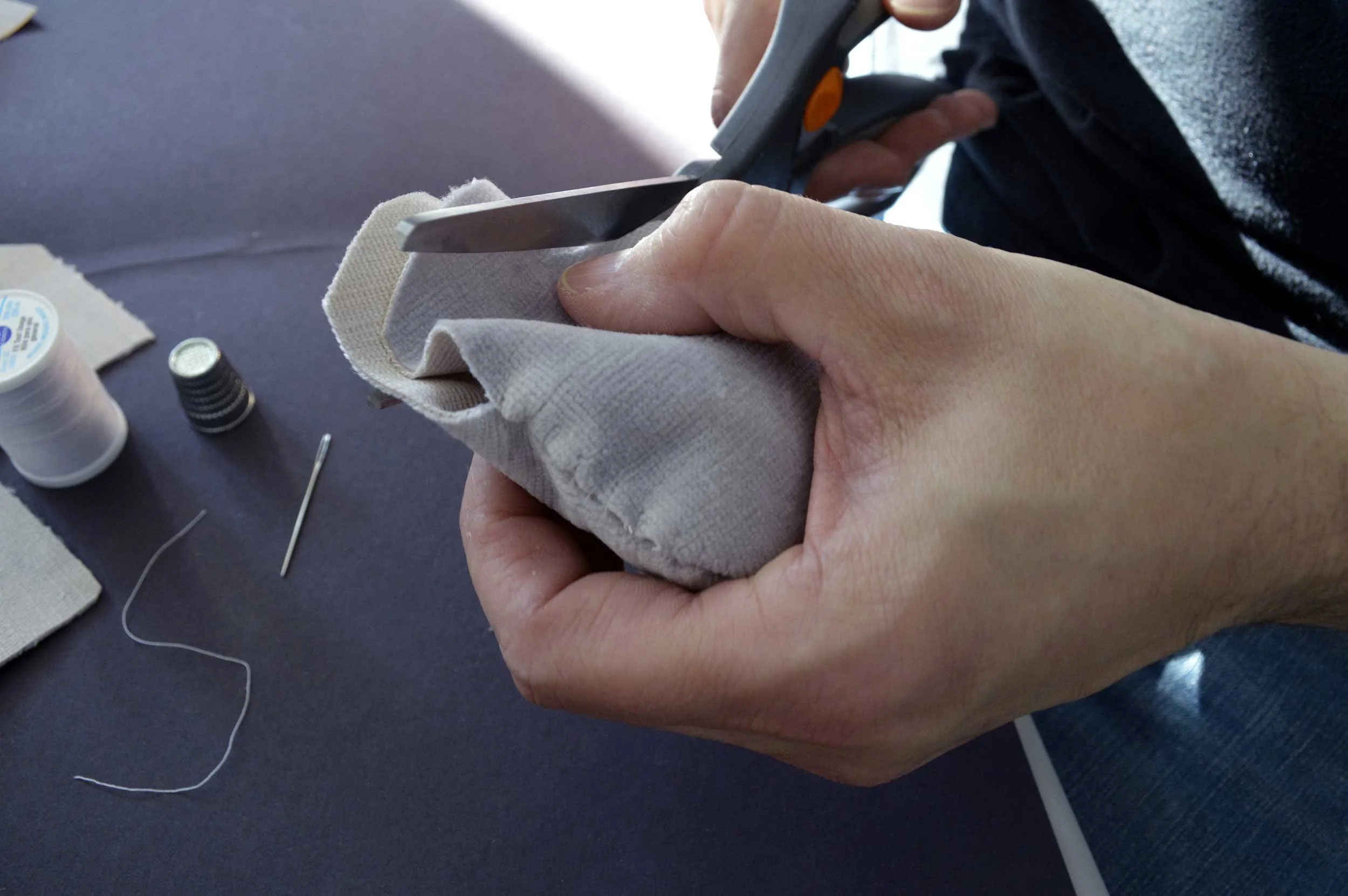  Velvet Stones (Process) ; Creek-collected stones, vintage lavender velvet, sewing materials; 100 count; 2019