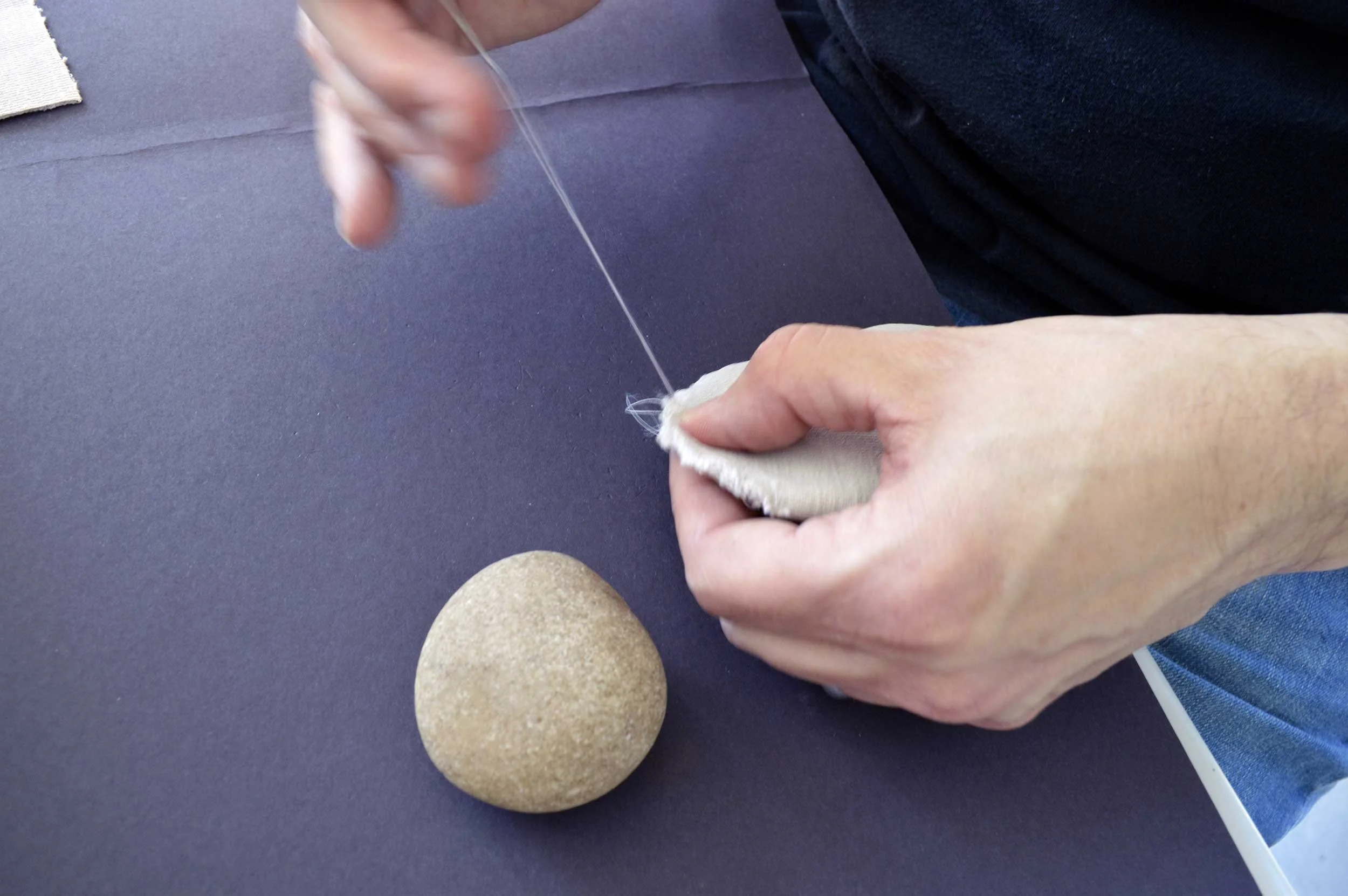  Velvet Stones (Process) ; Creek-collected stones, vintage lavender velvet, sewing materials; 100 count; 2019