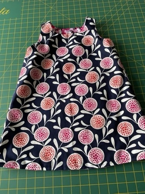 Navy seed pod childrens dress.jpeg
