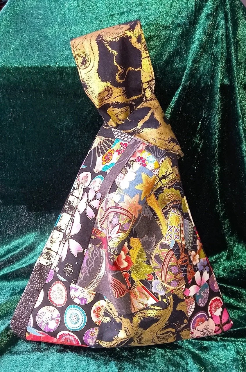 Side 1 gold and black japanese knot bag.jpeg