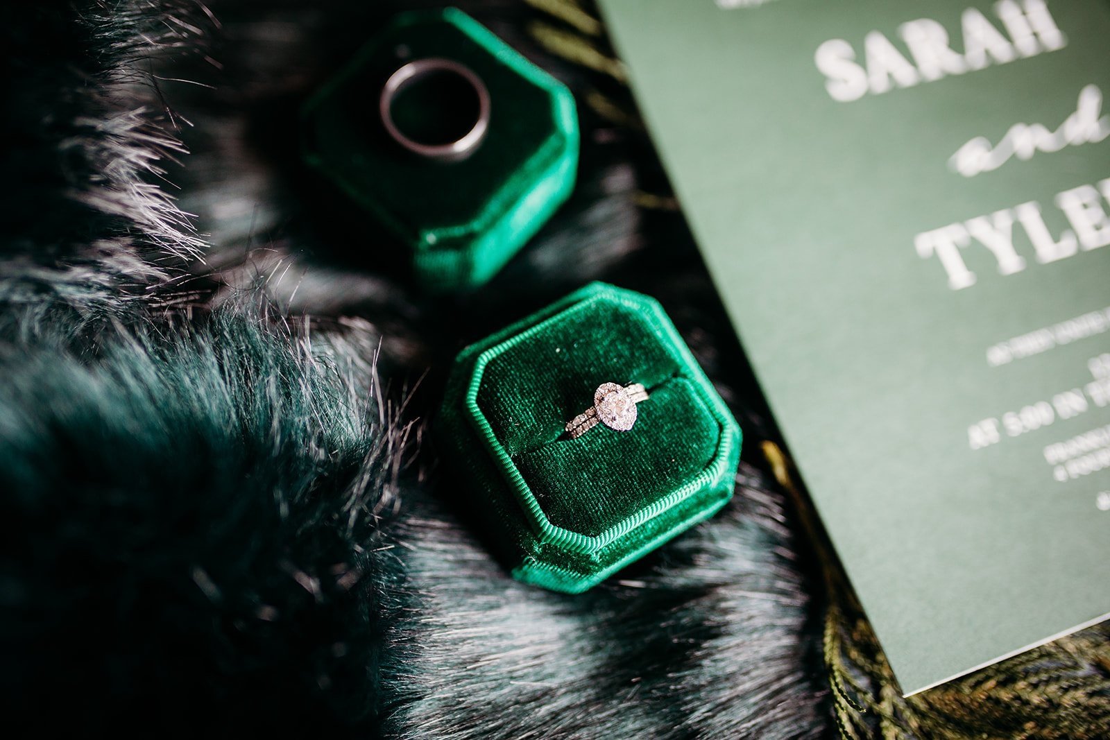 wedding ring rests in emerald green ring box for winter wedding