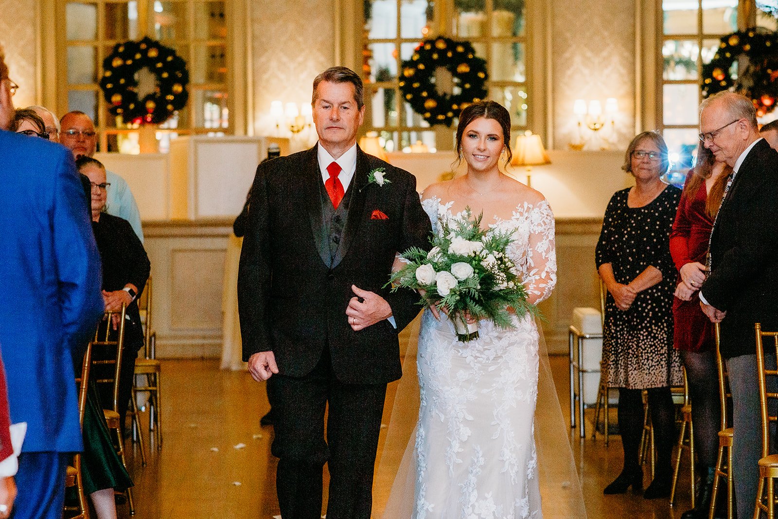 father walks winter bride down aisle for ceremony at the Franklin Plaza