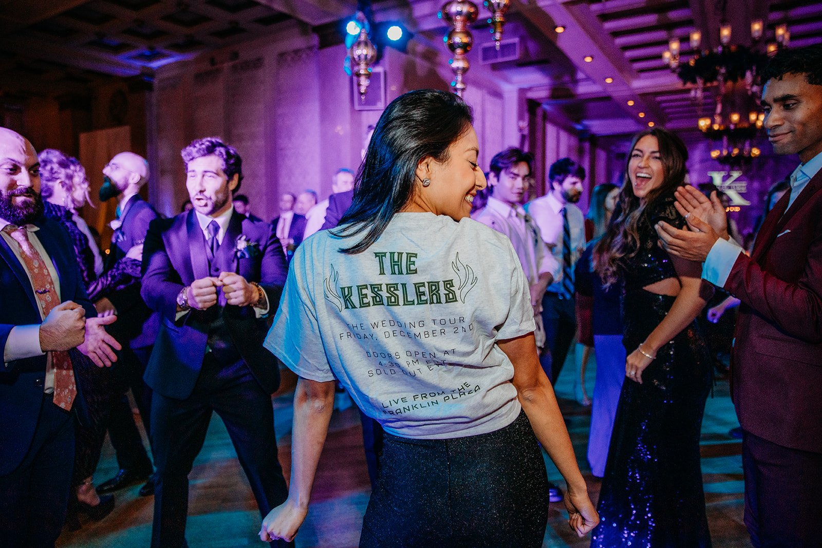 bridesmaid shows off custom t-shirt from Troy NY wedding reception