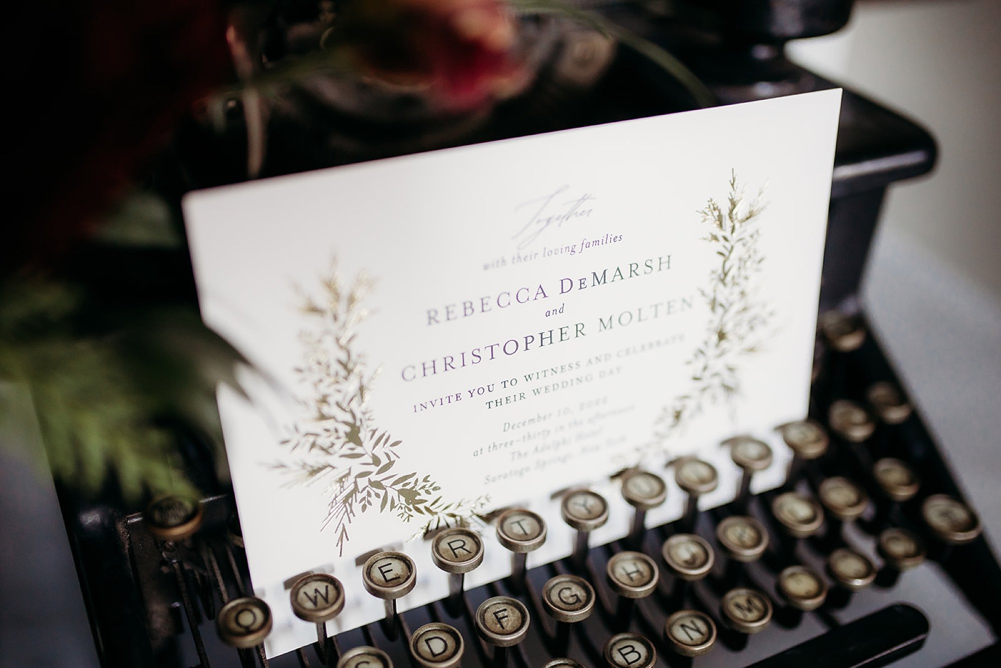 typewriter holds invitation for winter wedding 