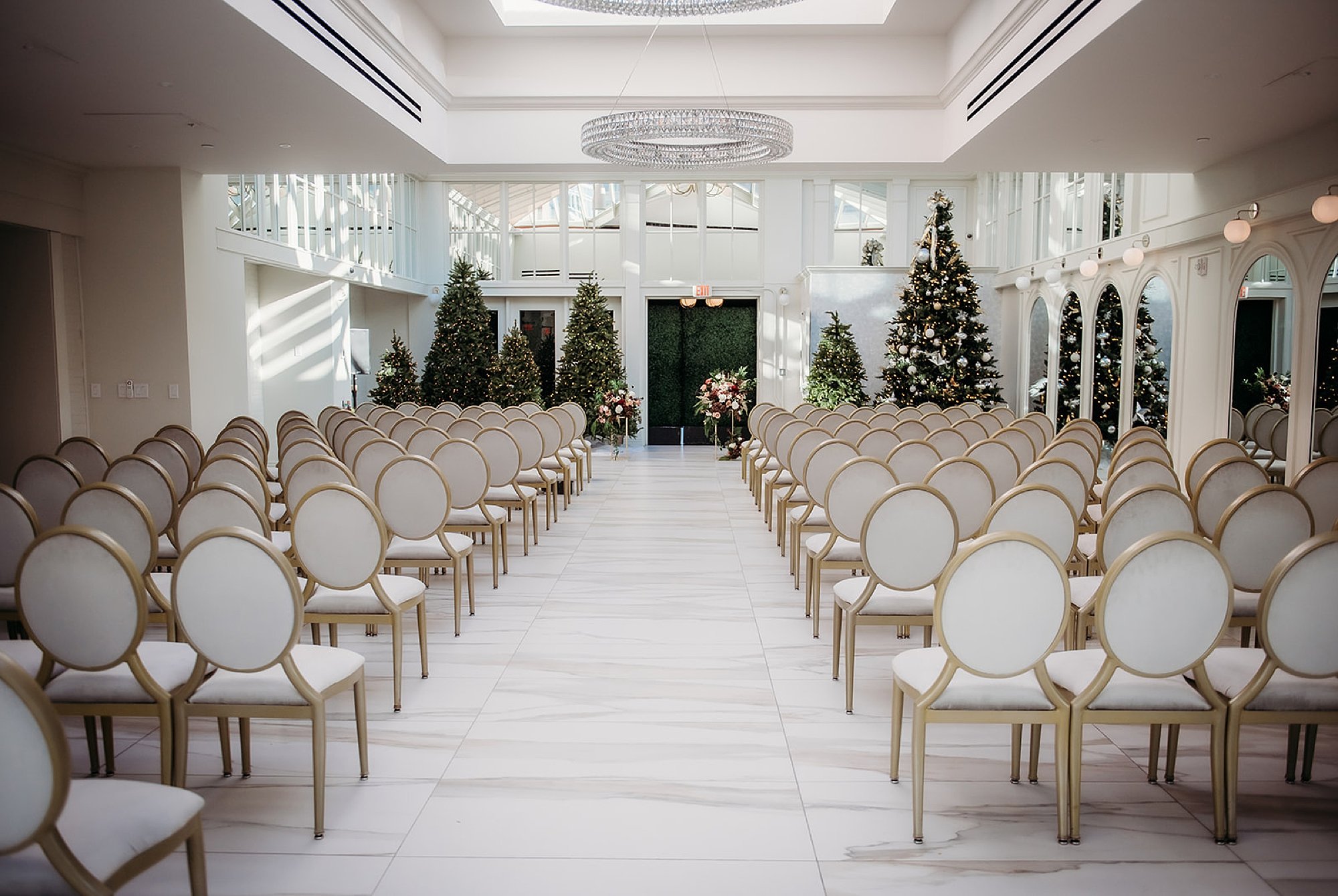 ceremony site with Christmas trees inside The Adelphi Hotel