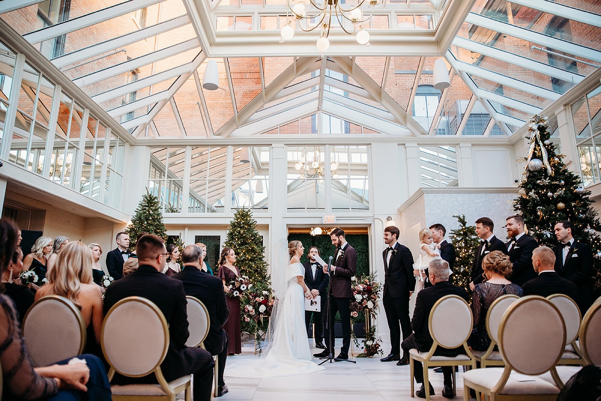 wedding ceremony in atrium at The Adelphi Hotel in Saratoga Springs NY