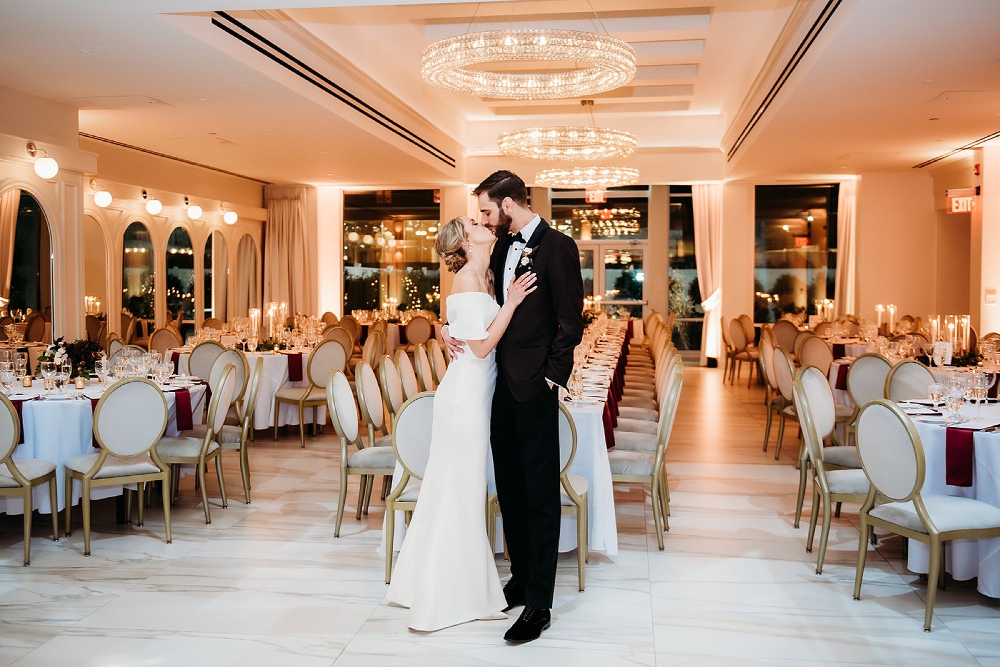 bride and groom dance during reception in the atrium at The Adelphi Hotel