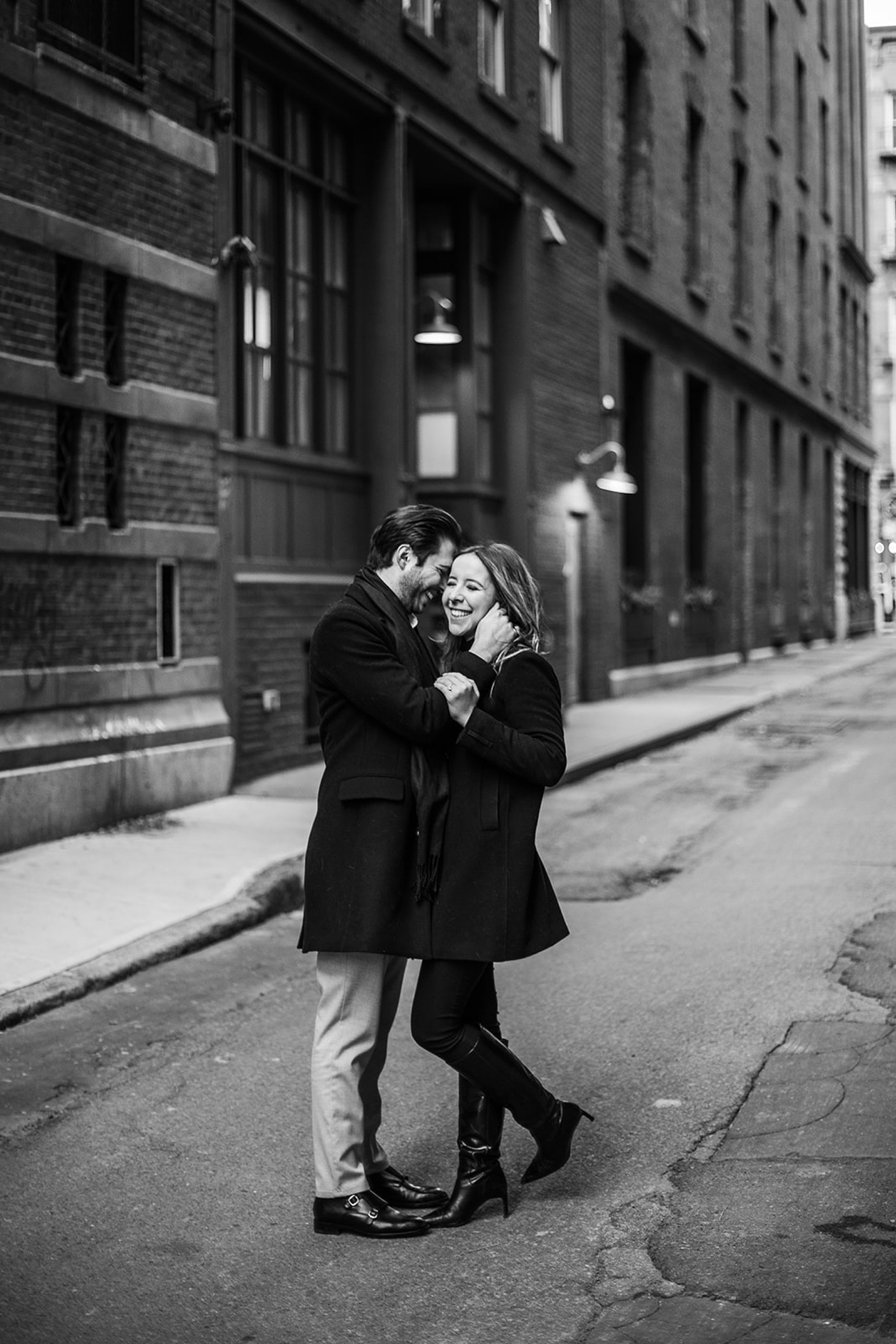 black and white portrait of couple hugging in side street of Tribeca NY