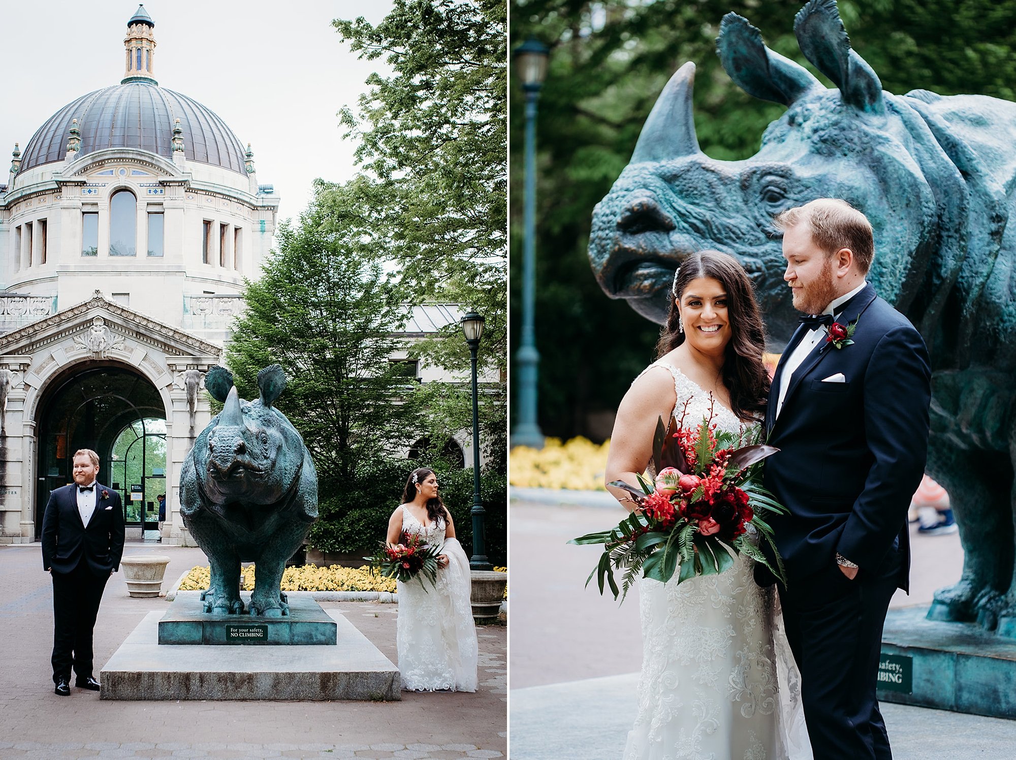 bride and groom smile together by rhino statute outside the Bronx Zoo