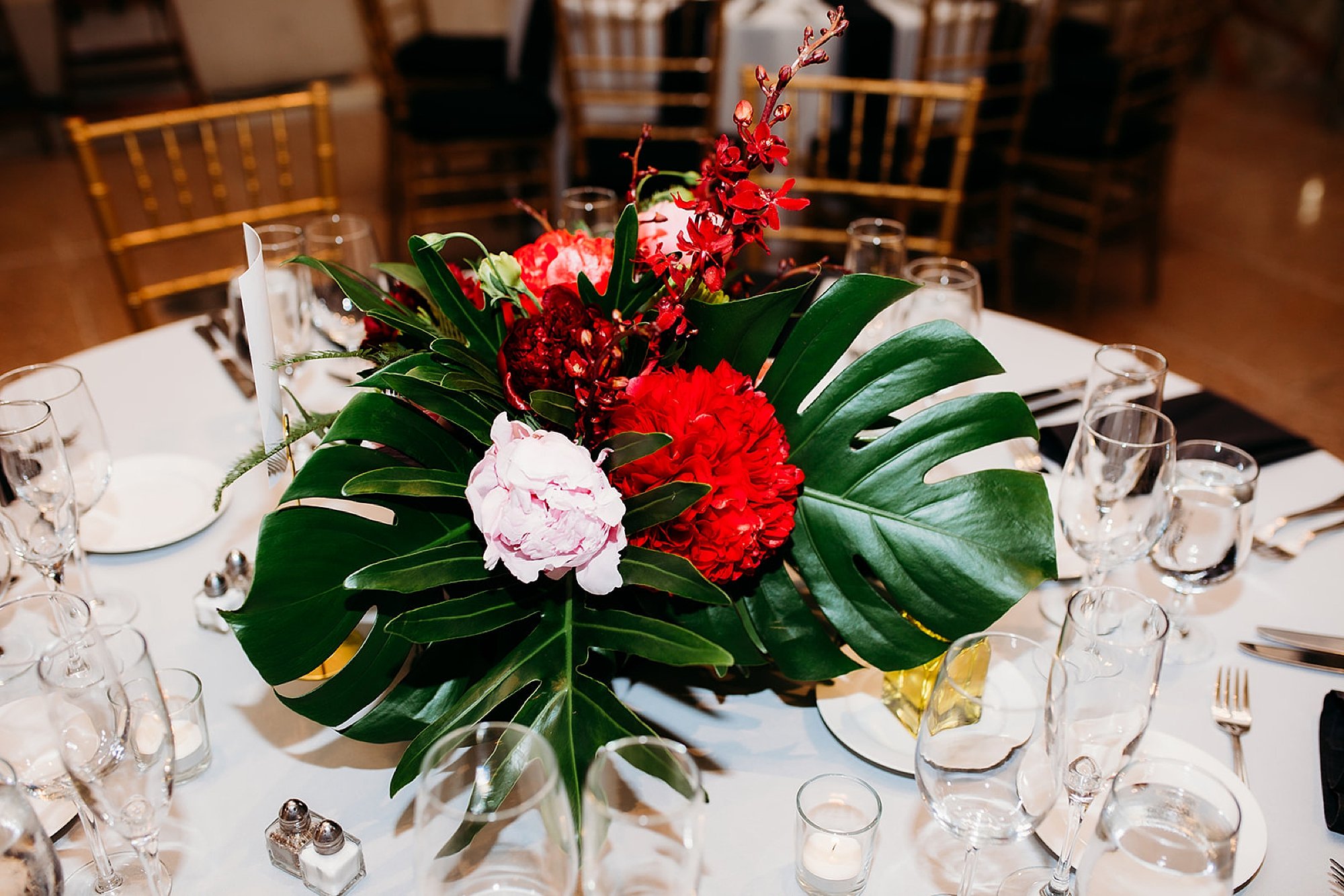 tropical floral centerpieces for The Bronx Zoo wedding reception at the Old Lion House
