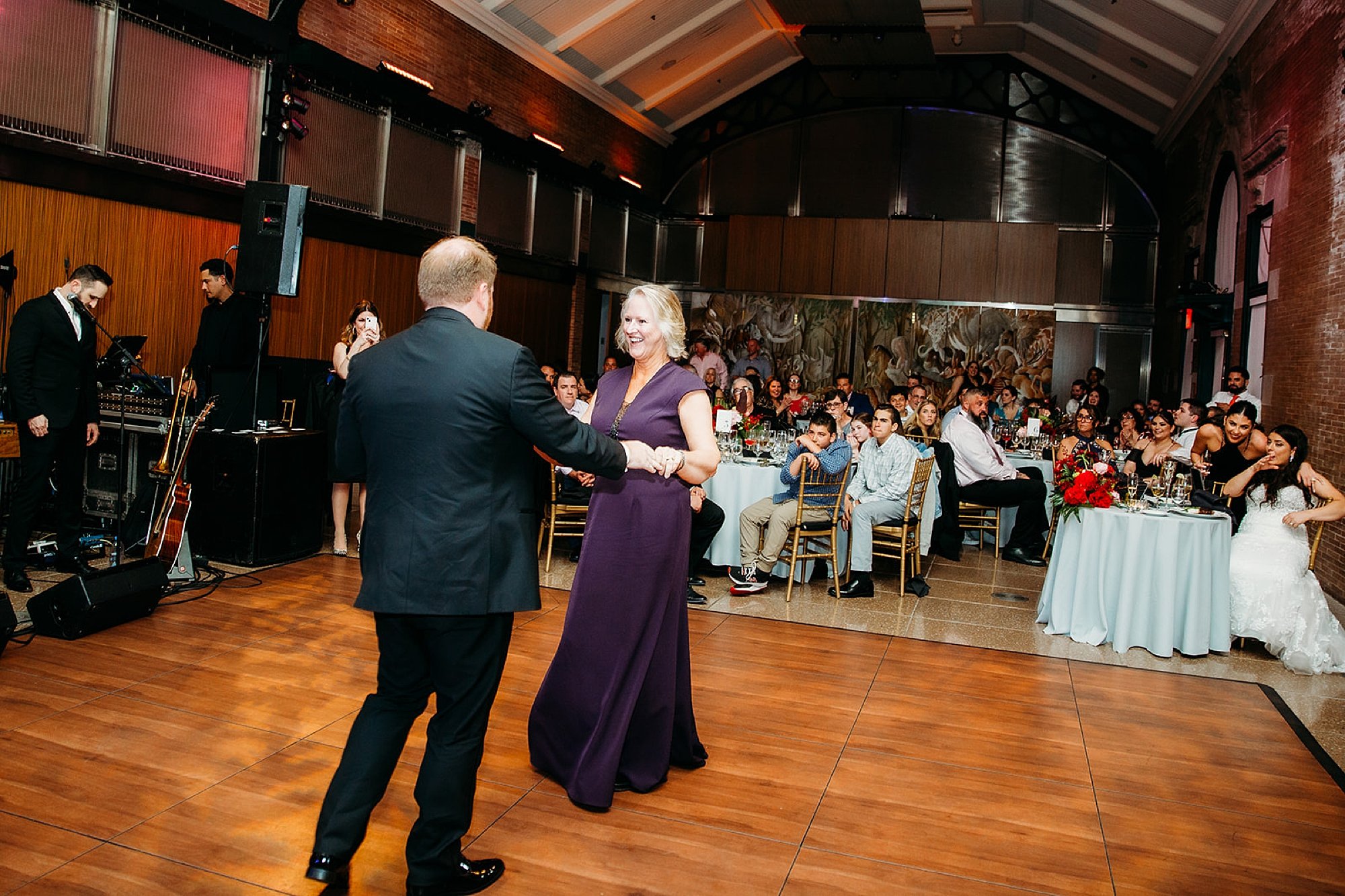 groom and mother dance during the Bronx Zoo reception