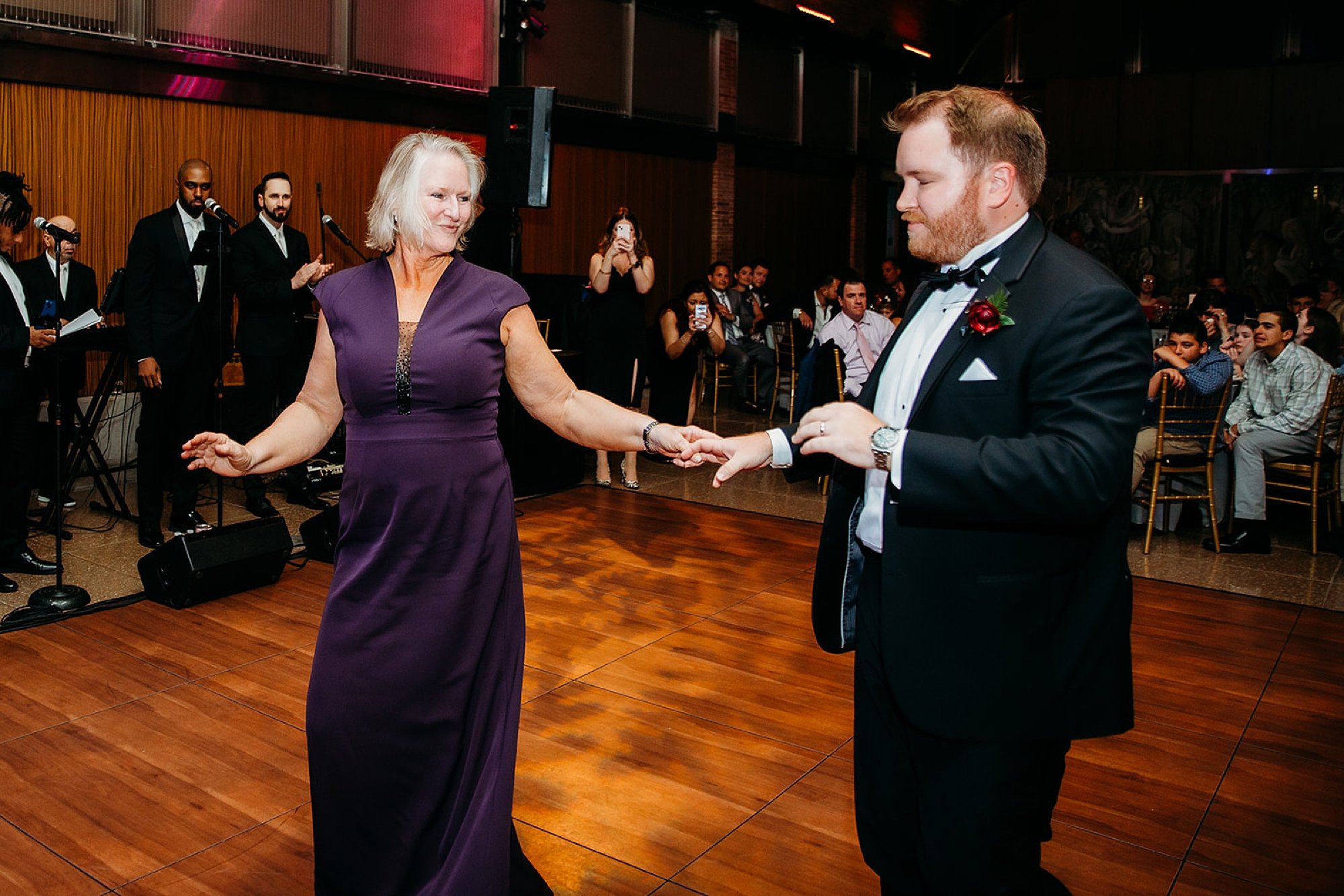 groom and mother dance during the Bronx Zoo reception