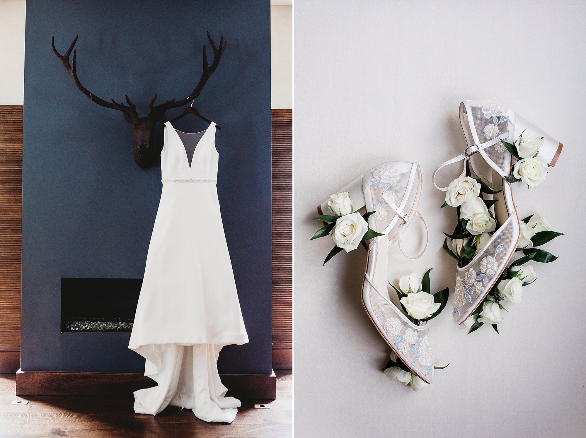 wedding dress hangs on deer antlers on blue wall at the Roundhouse