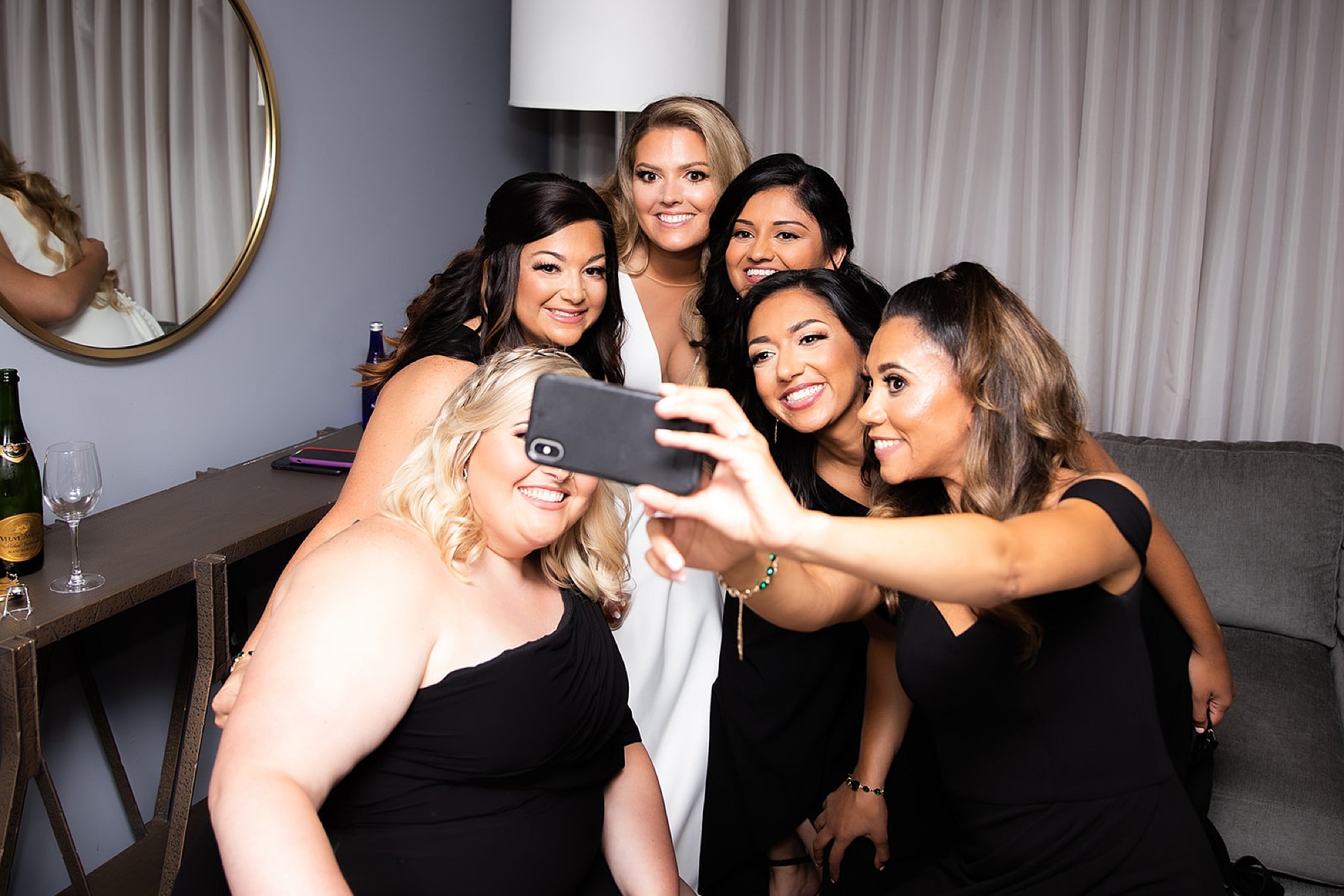 bridesmaids take selfie with bride at the Roadhouse