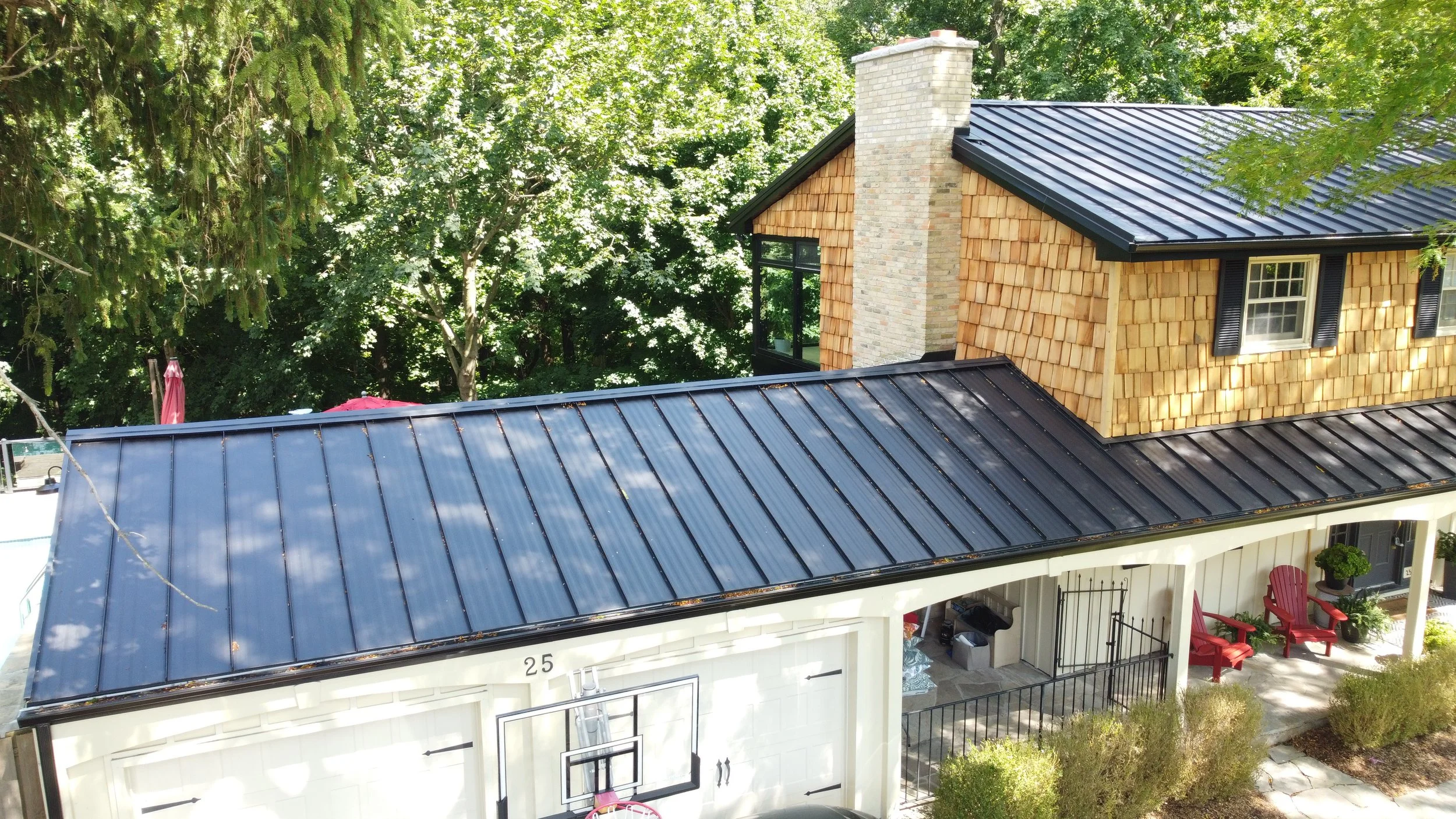 Standing Seam!  This home in Orchard Park got a stunning new standing seam roof.  24 gauge steel and textured ebony finish