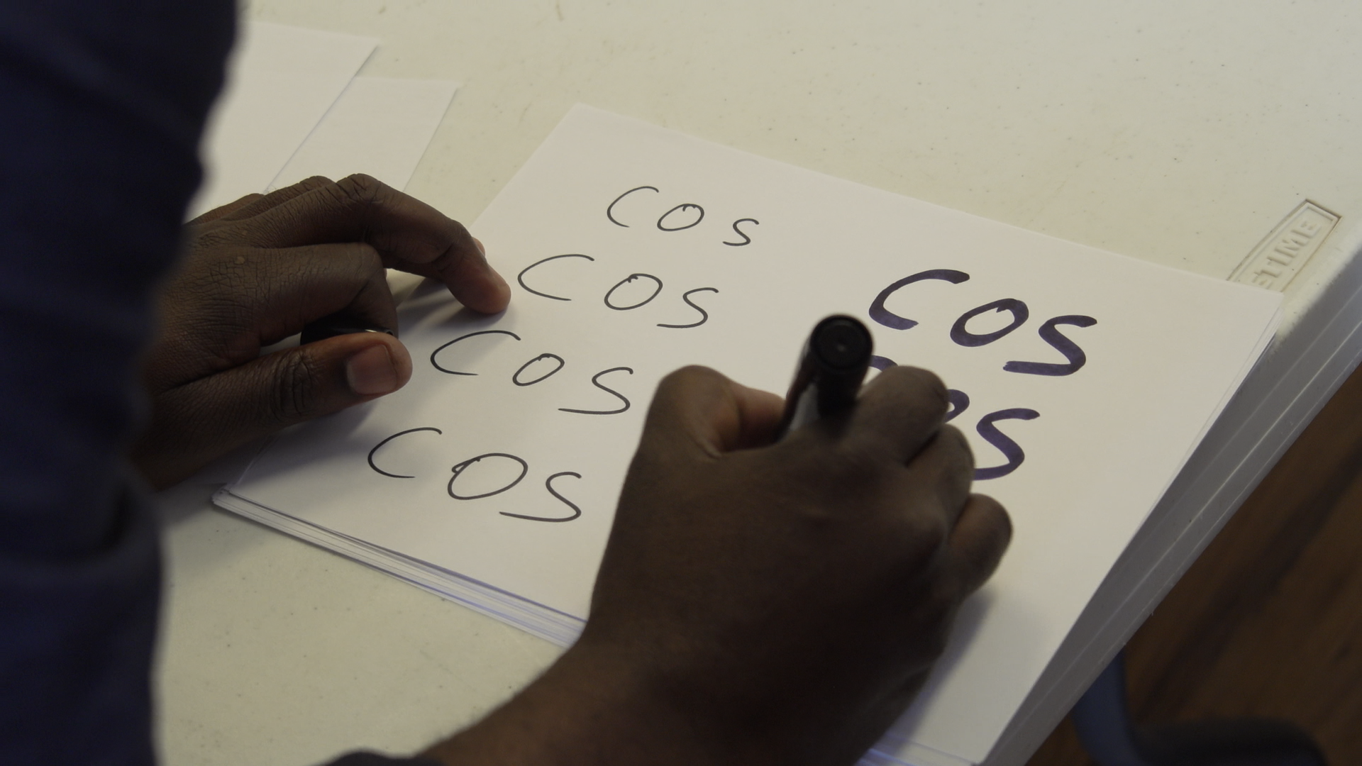 Yemi Writing COS DH Cam.png