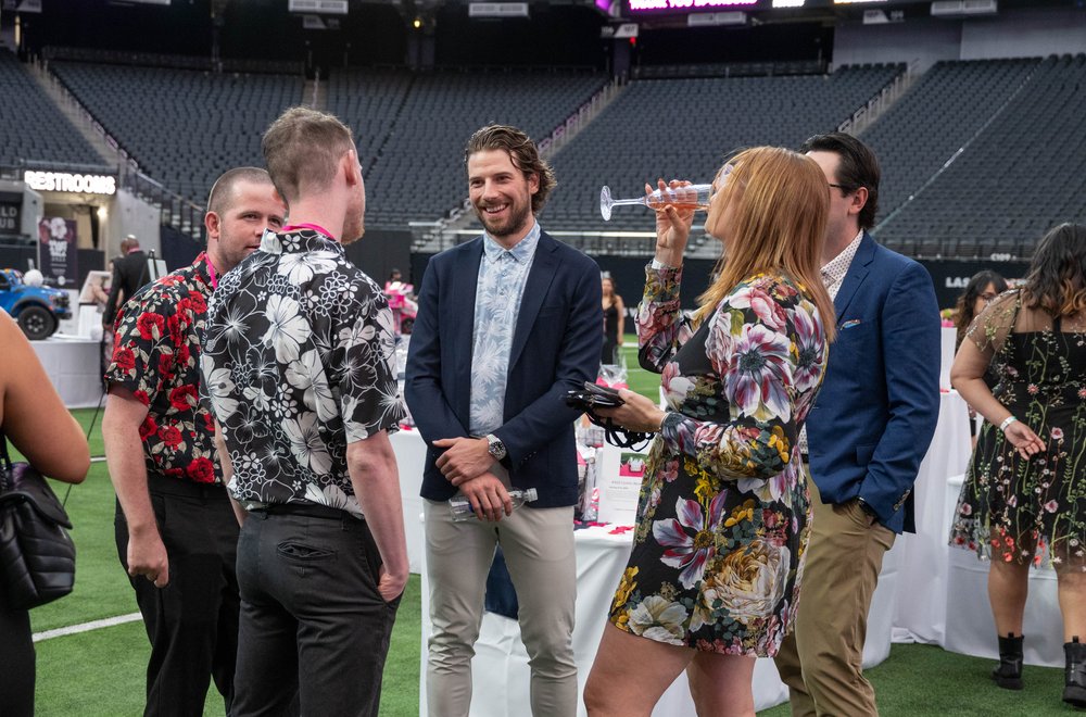 Vegas Golden Knights hockey star, Shea Theodore, (middle) interacts with guests Grant A Gift Gala 2023 at Allegiant Stadium.jpg