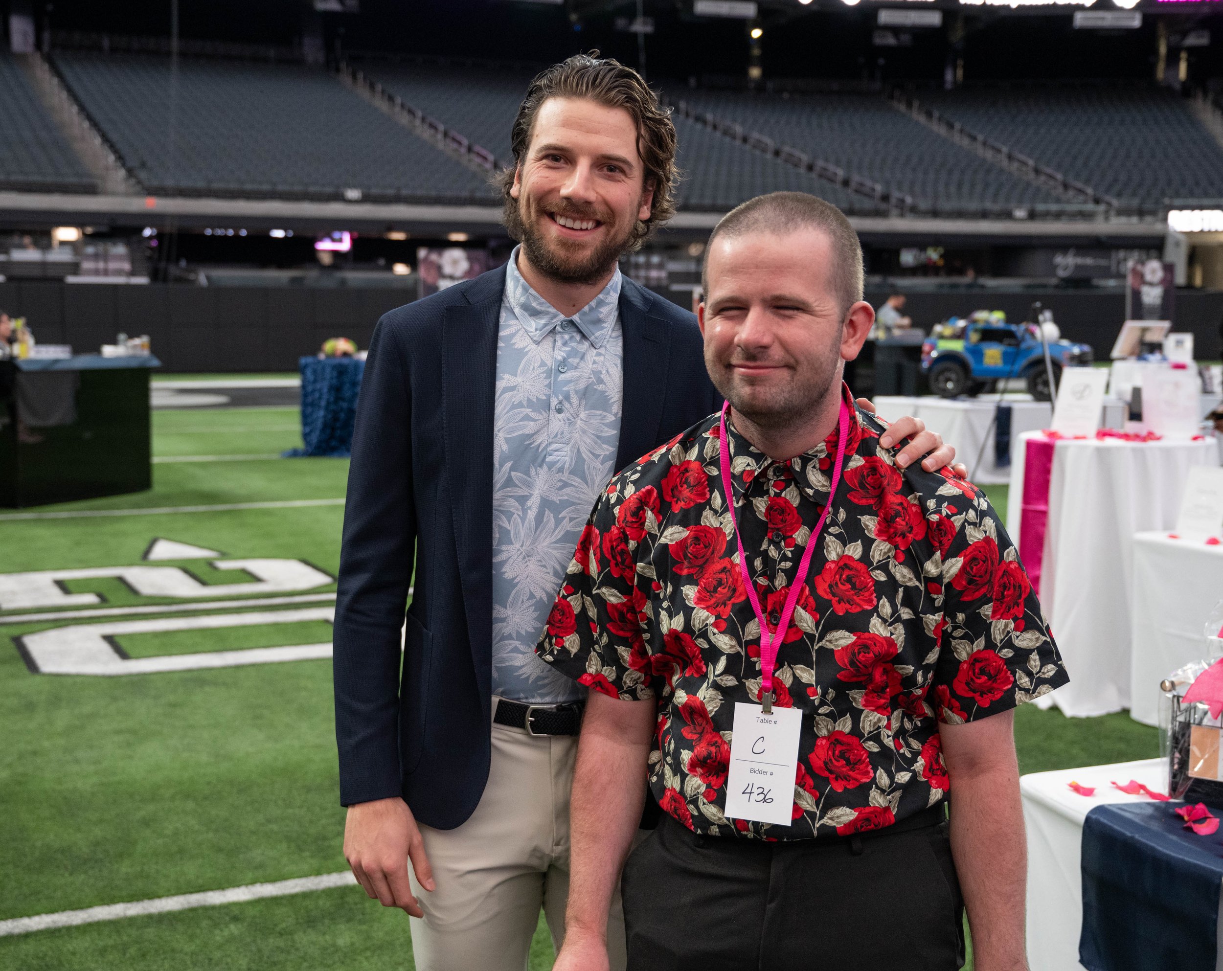 Vegas Golden Knights star Shea Theodore on the field of Allegiant Stadium while at the Grant A Gift Gala 2023.jpg