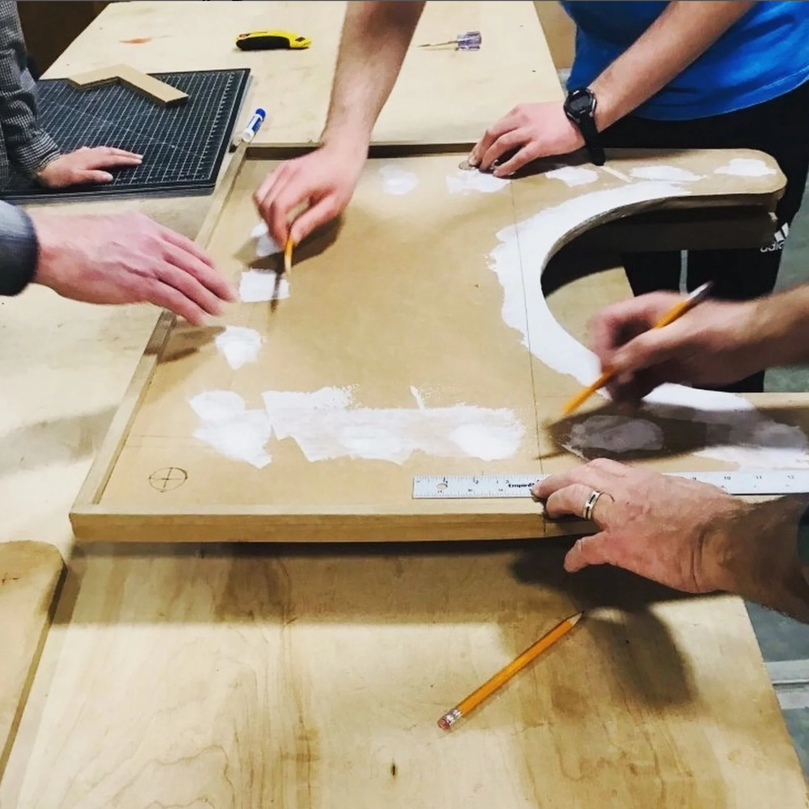 makers at work revising wheelchair table prototype