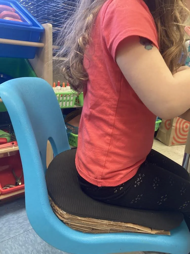 trying out the new lift for school chair