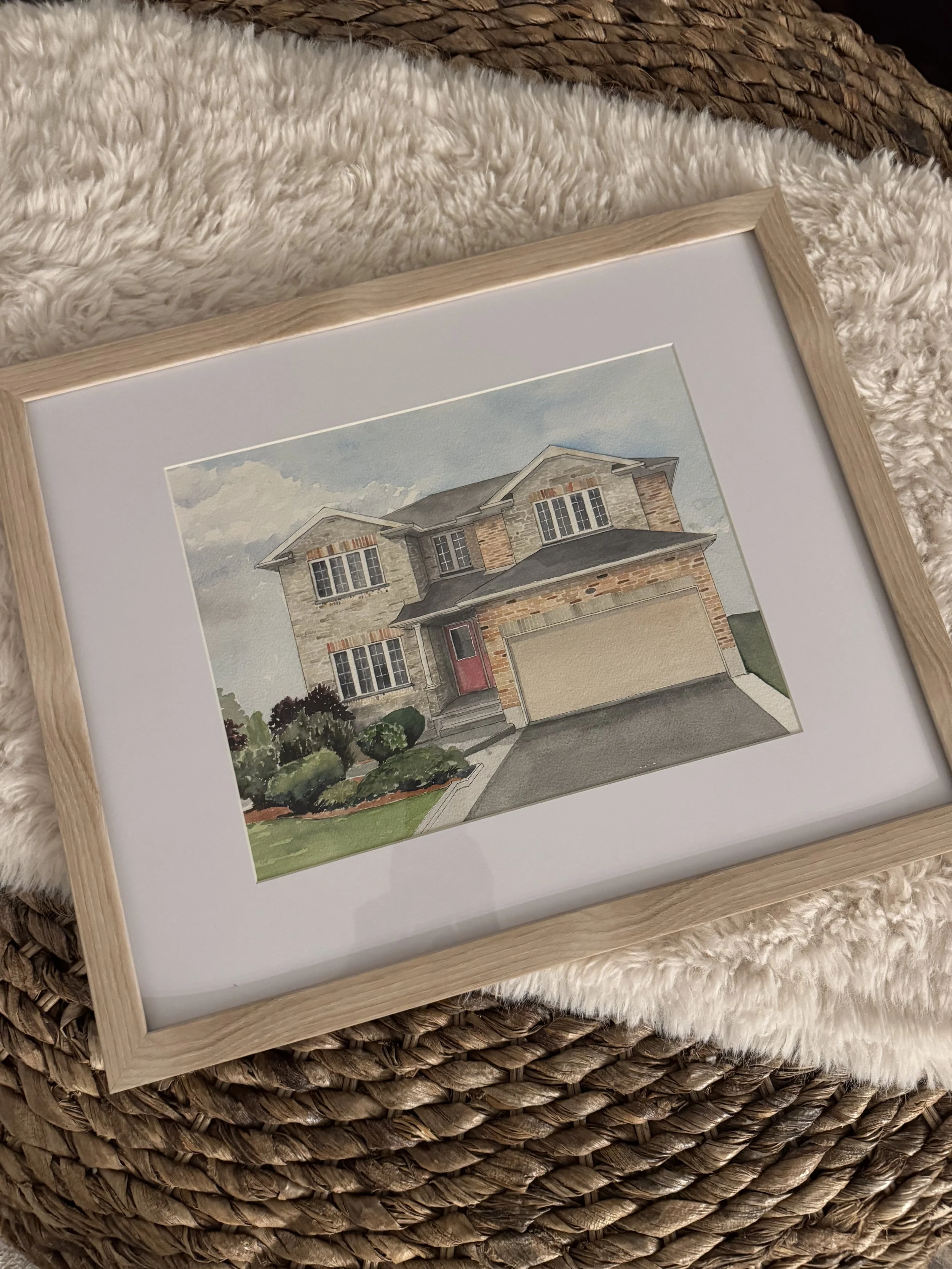 framed yellow brick home on a carpet