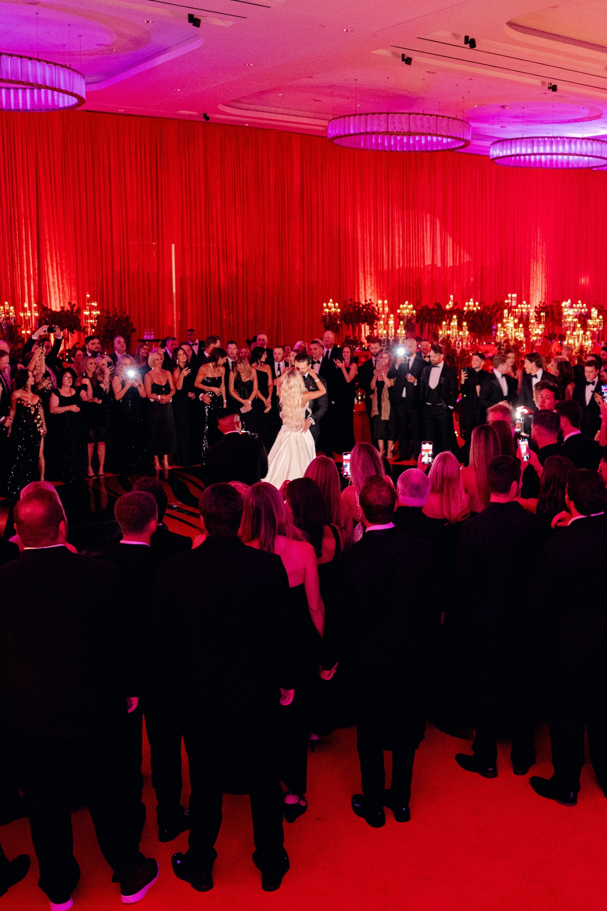 First dance at a red and black modern wedding reception at Fontainebleau Las Vegas.  Luxury Las Vegas Wedding Planner Andrea Eppolito.