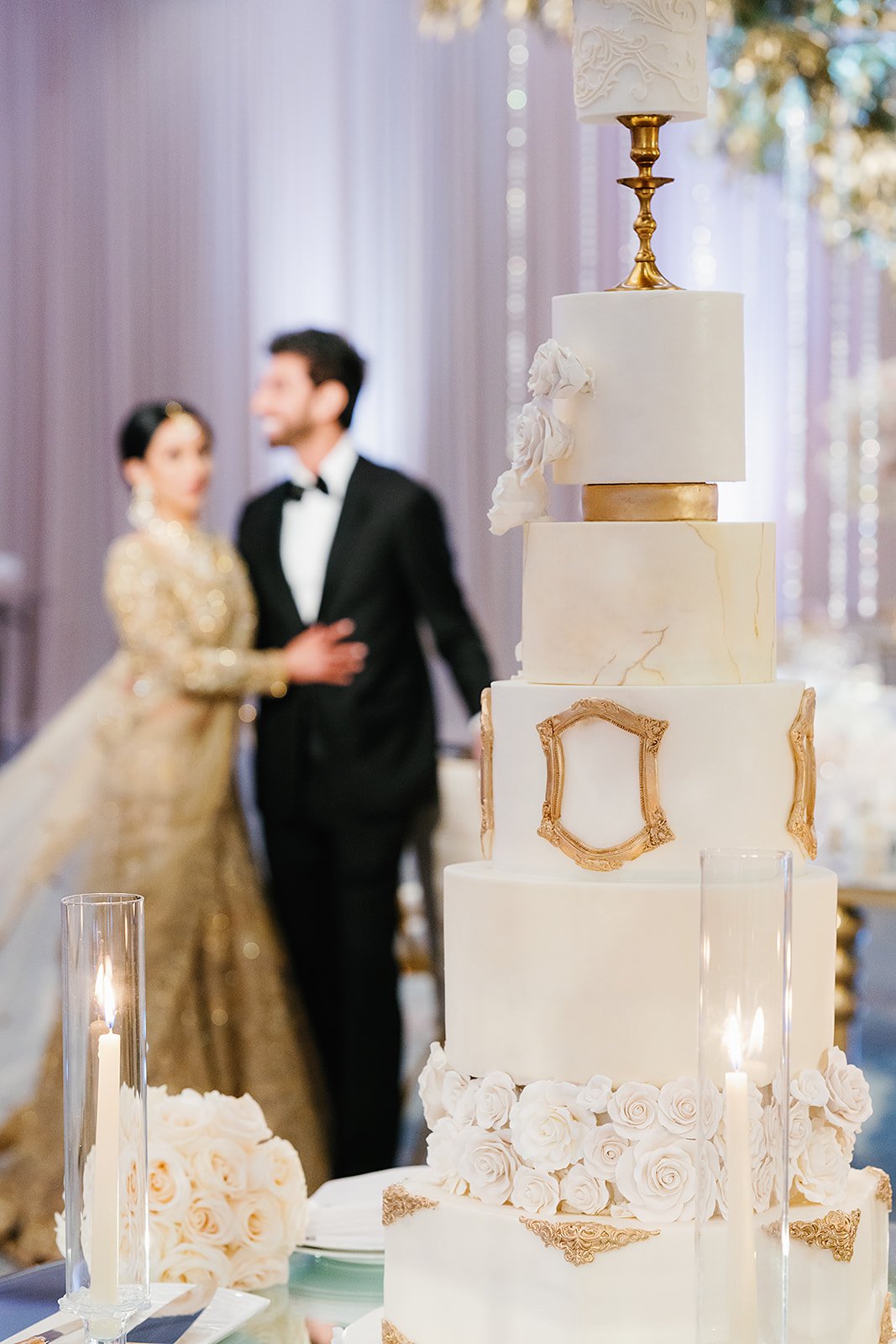 Bride and groom near fairytale wedding cake,