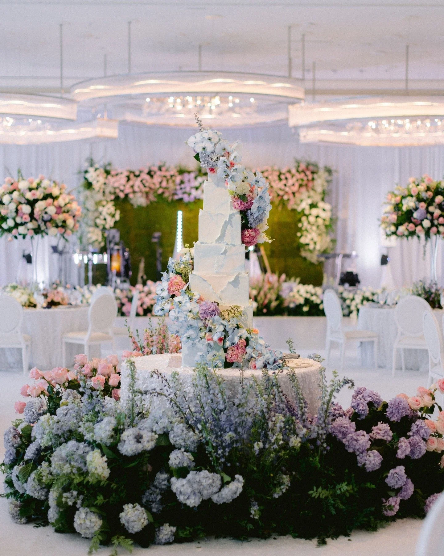 Cake is the jewelry of the wedding reception. I love wrapping a cake in florals and setting it in the center of the room. It gives everyone a gorgeous view of the sweet treat coming at the end of the evening. 

Las Vegas Wedding Planner @andreaeppoli
