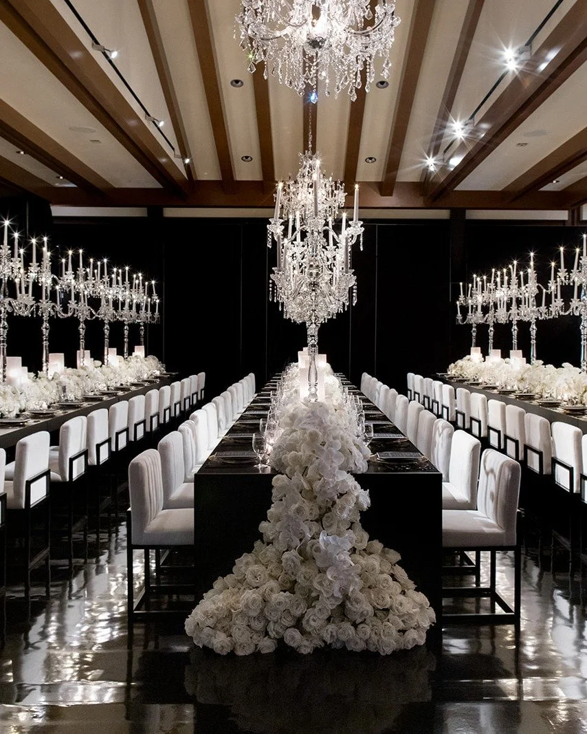 Bring me all the flowers! Make the tables so full, they spill off the edges and out of the photo frame!

Jessie and Rob wanted a wedding reception that was full and lush with classic elegance. Jess specifically wanted drama and contrast.

Pristine wh