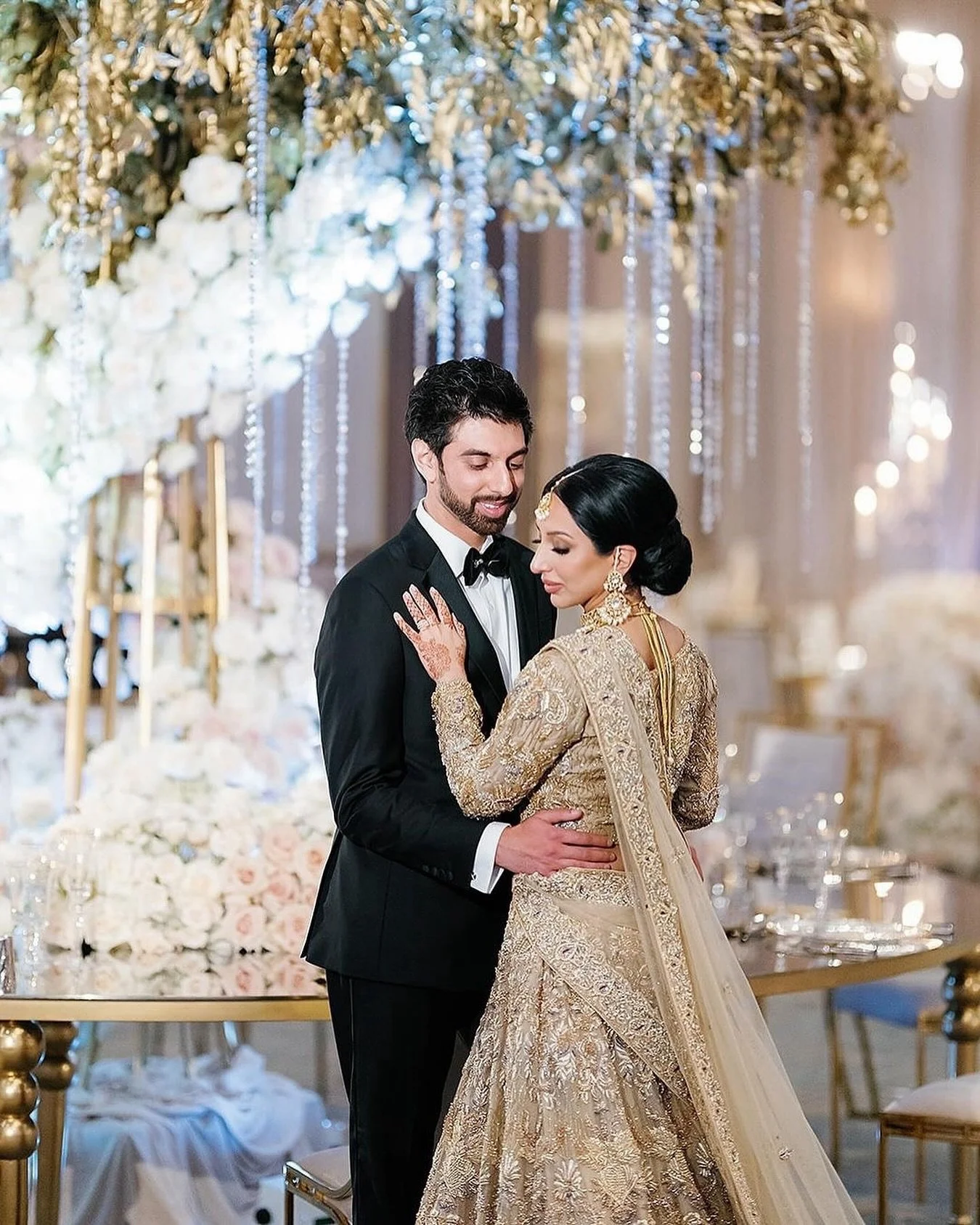 Happy Anniversary Sameera and Zain. 

Their luxe Indian wedding was a study in neutrals, with glamorous accents of gold and crystal, mirror topped tables, and an abundance of hand opened florals. 

Three years later, they are just as beautiful and in