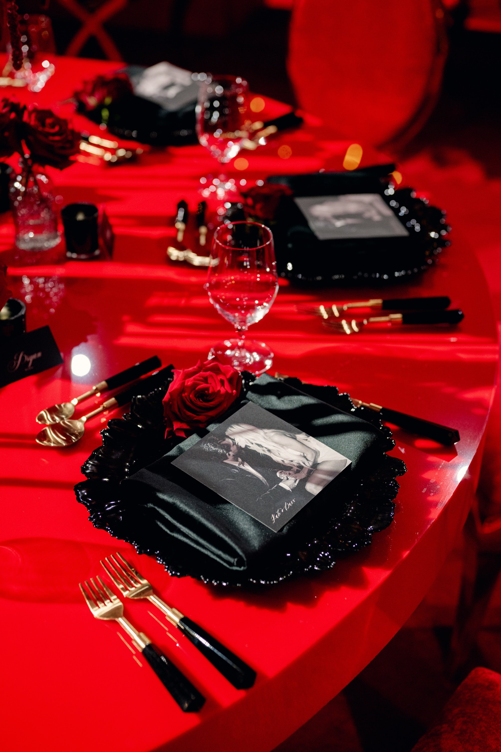 Custom menus with the couple's engagement photos. Red and black modern wedding reception at Fontainebleau Las Vegas.  Luxury Las Vegas Wedding Planner Andrea Eppolito.