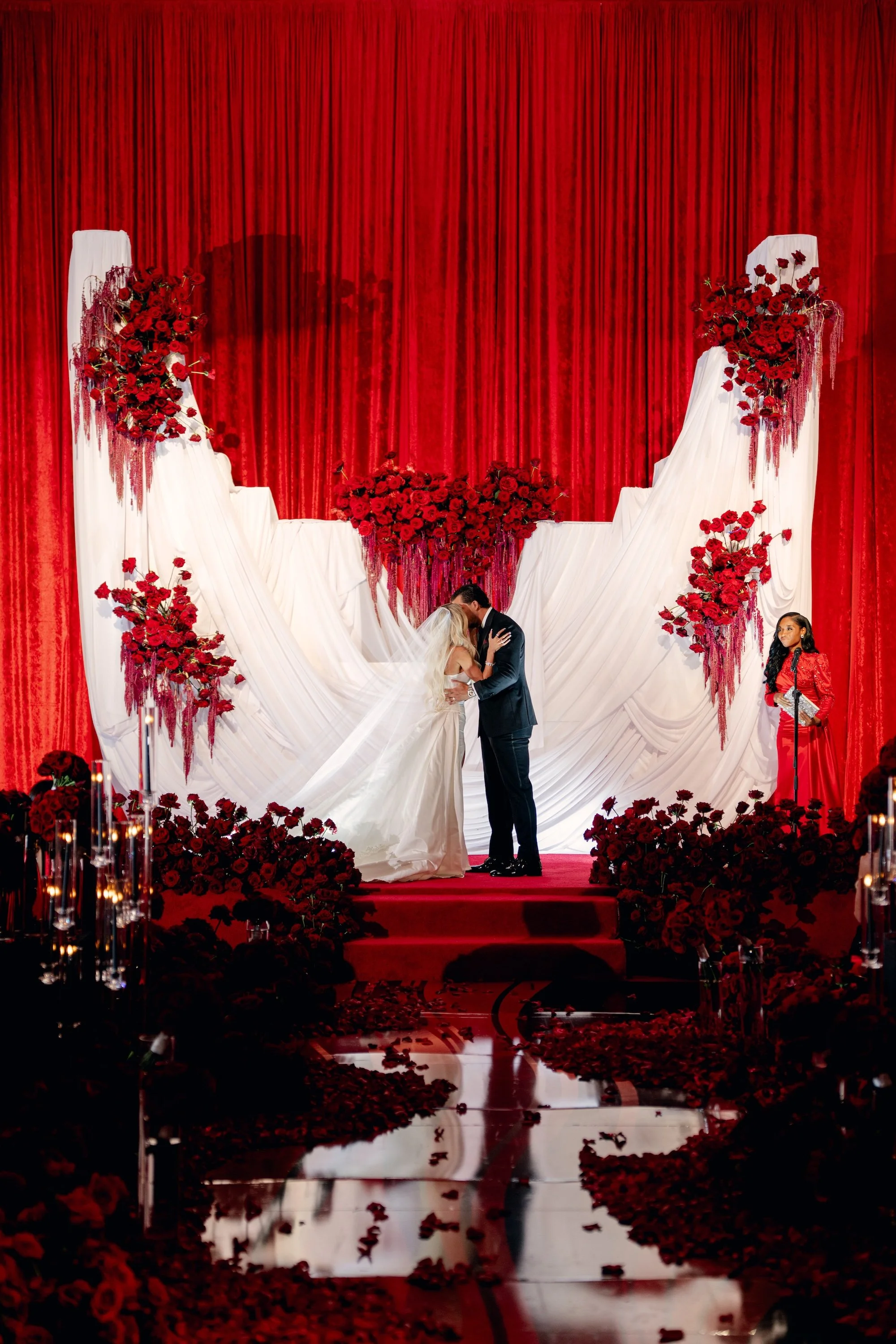 First kiss at luxe, red and white modern wedding. Luxury Las Vegas Wedding Planner Andrea Eppolito.