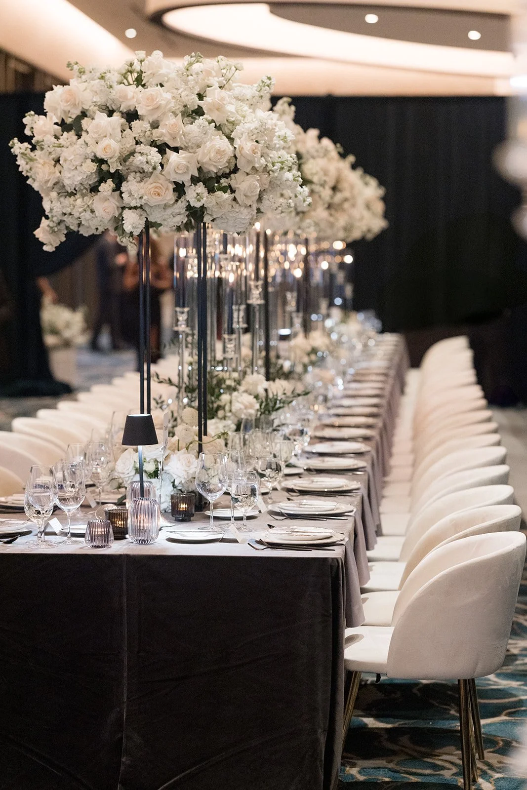 Long wedding tables with white flowers