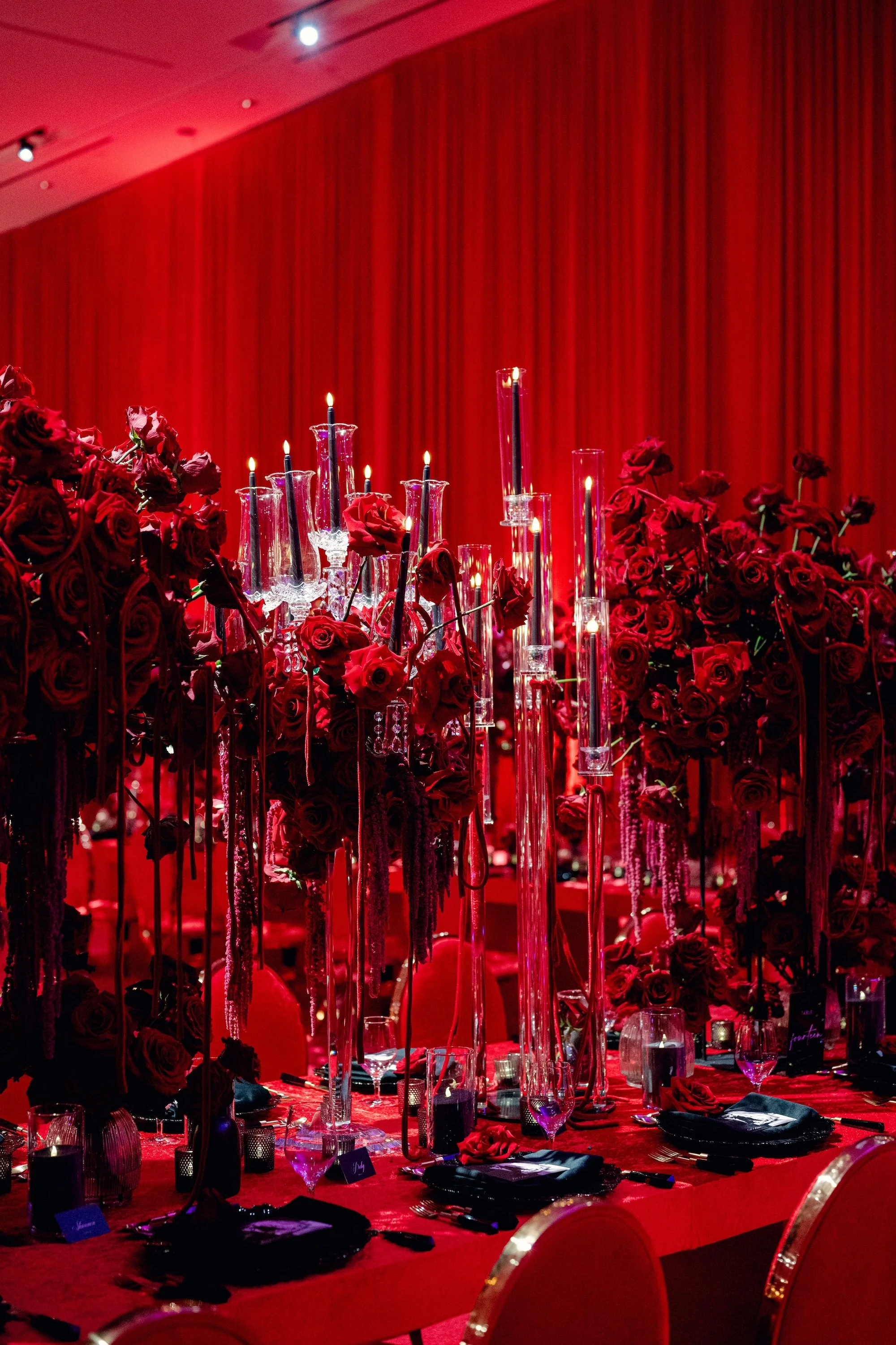 Red candles in centerpieces. Red and black modern wedding reception at Fontainebleau Las Vegas.  Luxury Las Vegas Wedding Planner Andrea Eppolito.