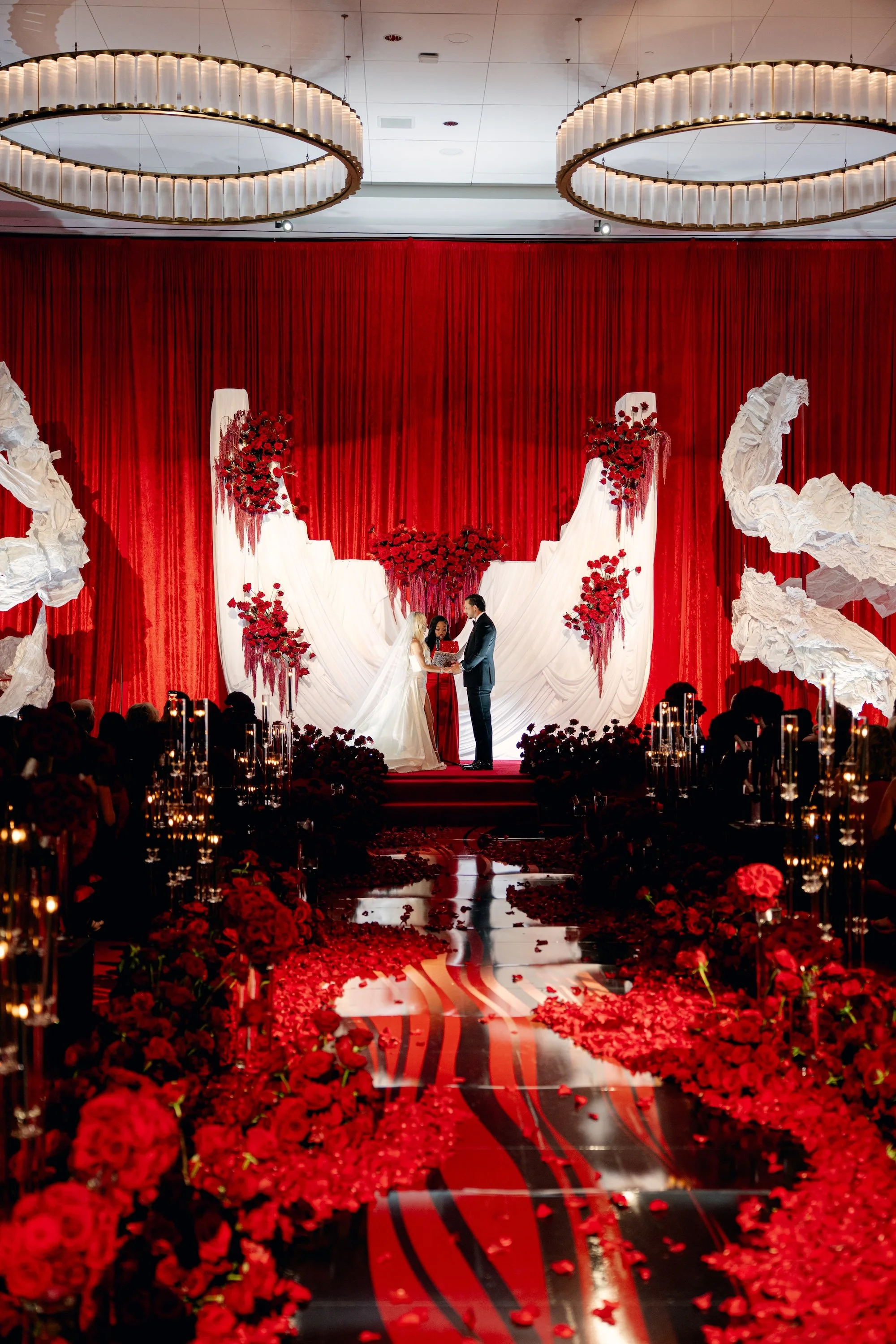 Reverend Roxy at luxe and romantic red wedding.  Luxury Las Vegas Wedding Planner Andrea Eppolito.